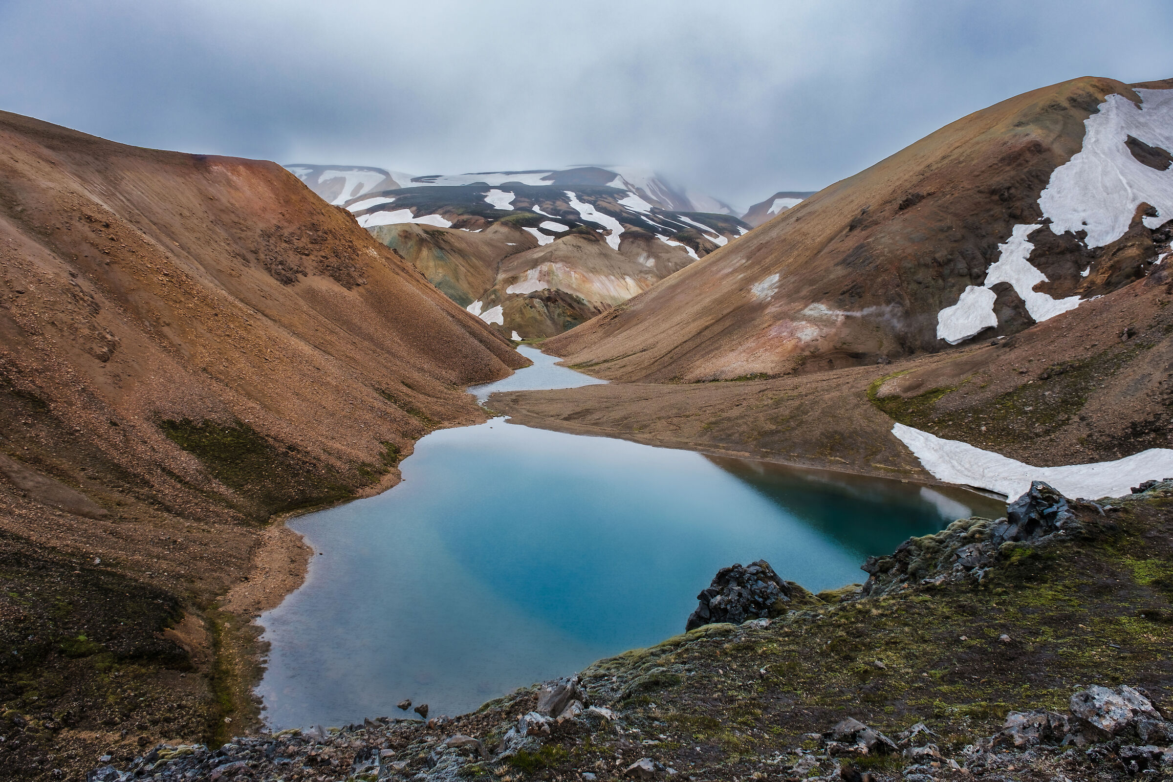 A pond in the colourful mountains of Landmannalaugar