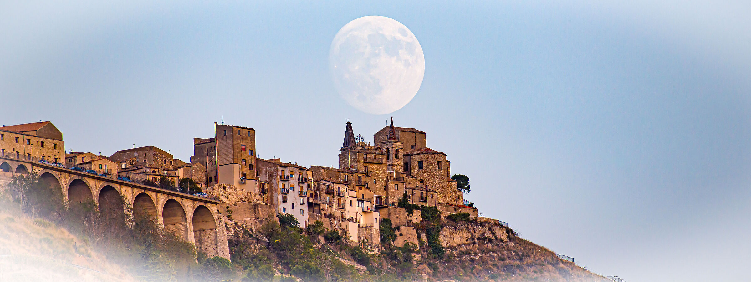 The Moon over the village of villages or Petralia Soprana.