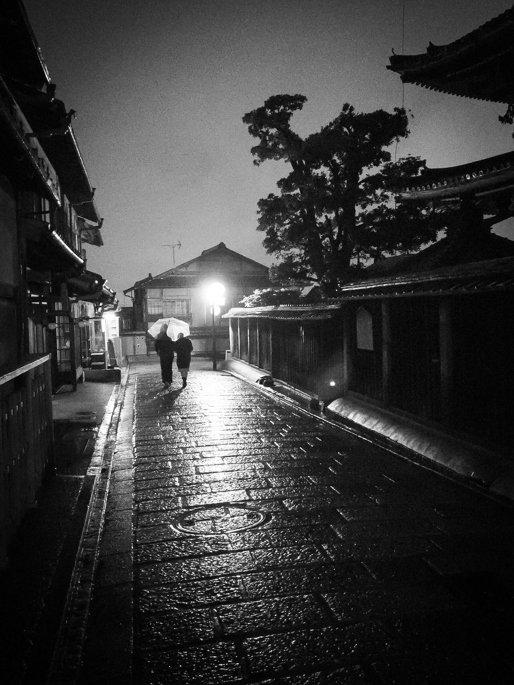 Couple walking in the rain