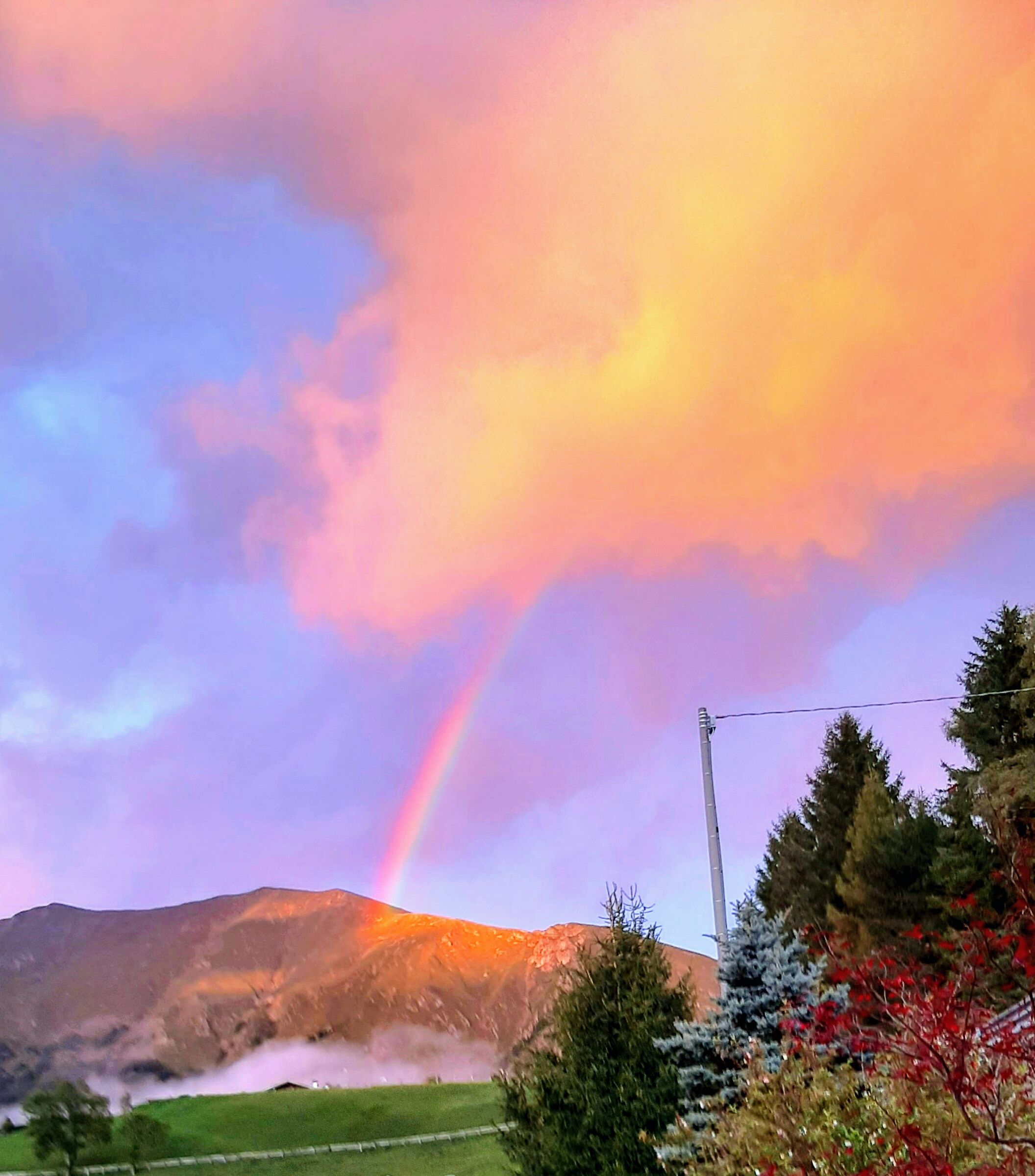 Rainbow and sunset on the mountain
