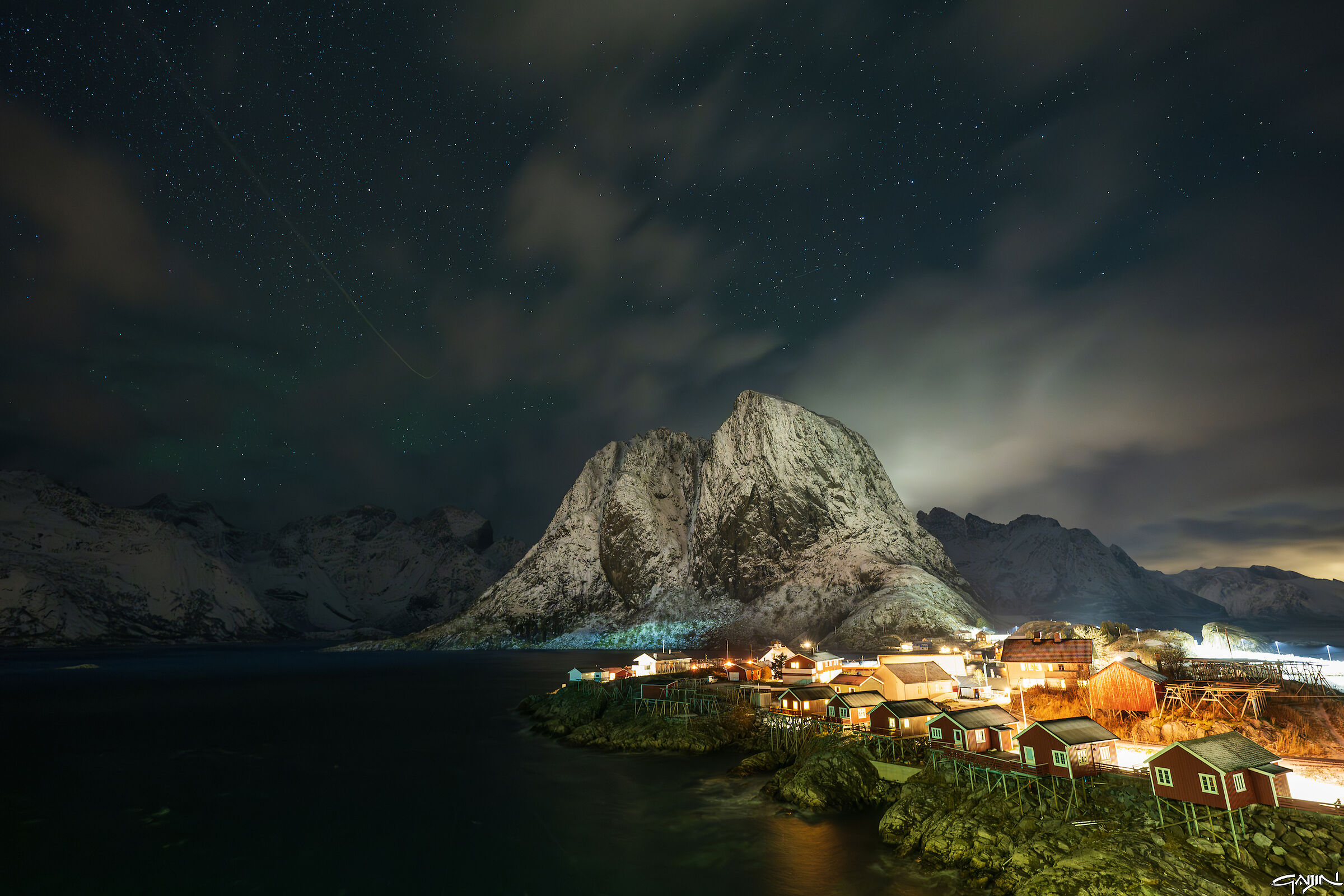 Hamnoy under a light aurora