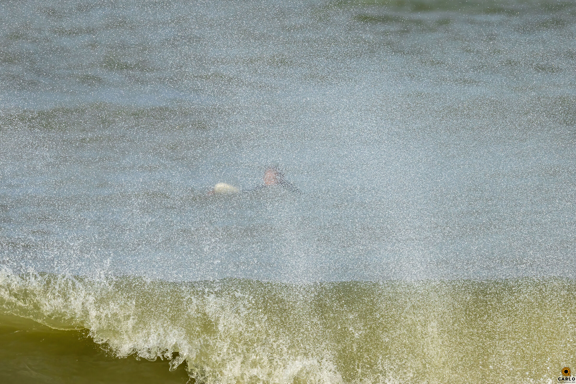 Surfing behind the waves