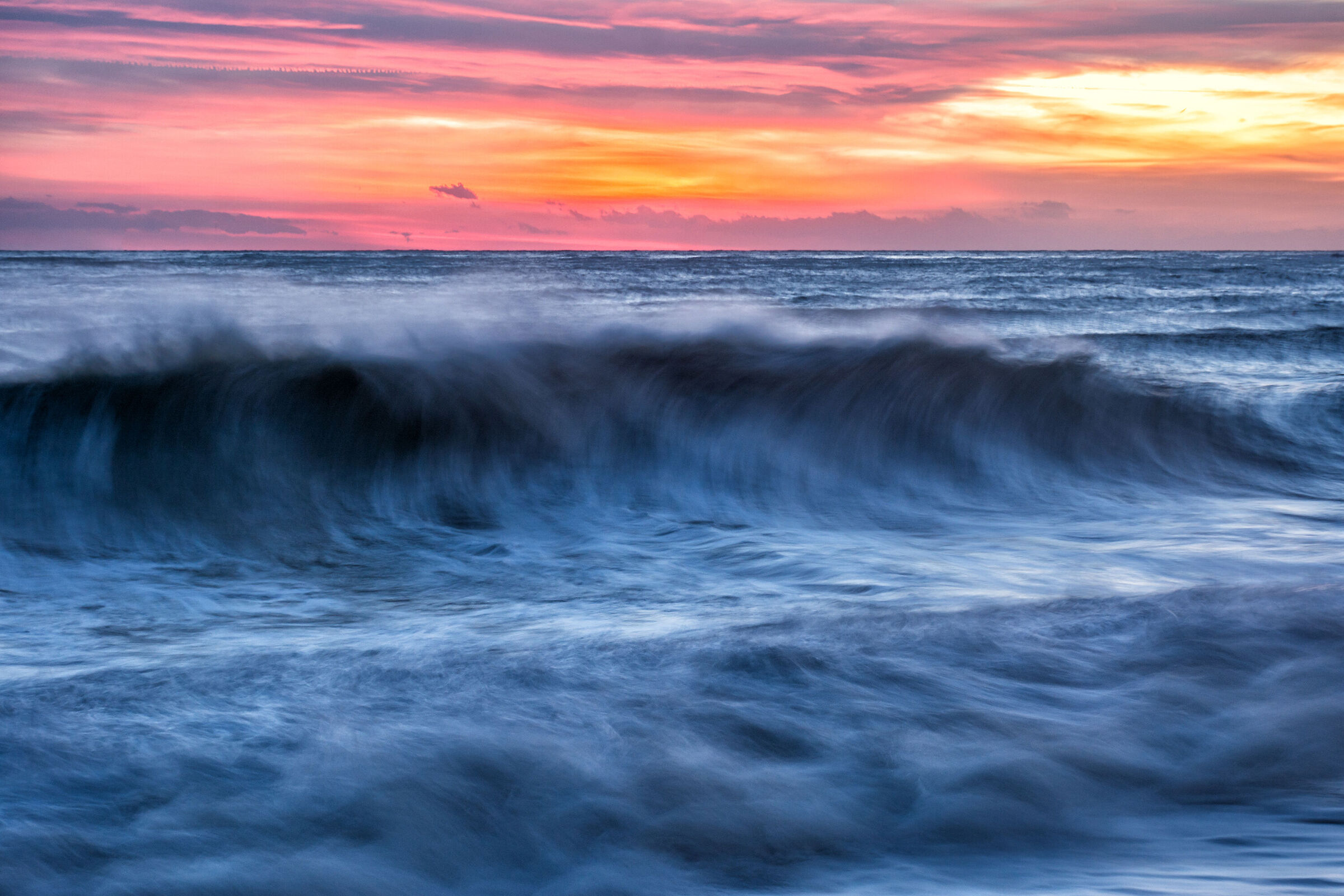 The sunset and the wave