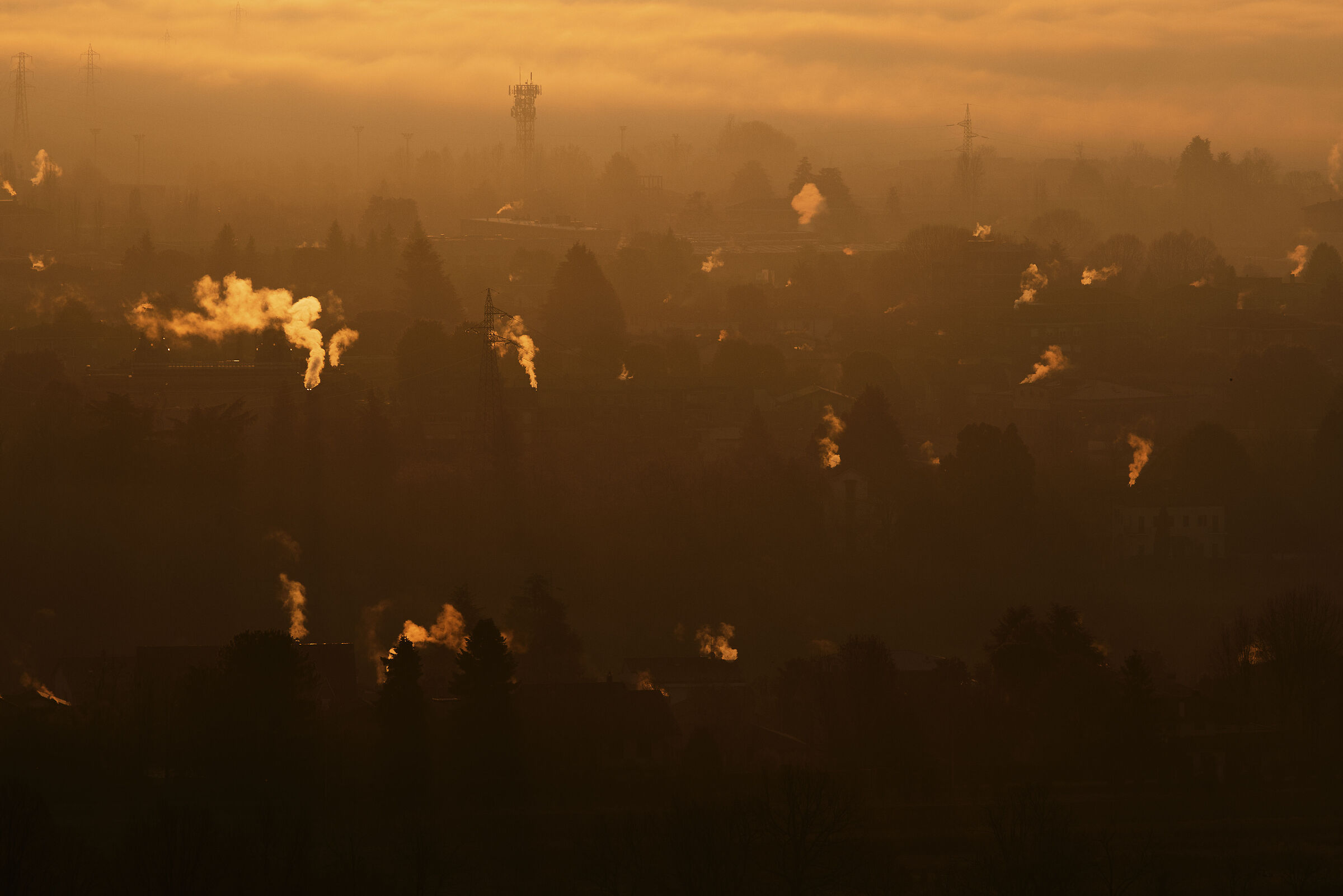 The smoke of the chimneys at dawn