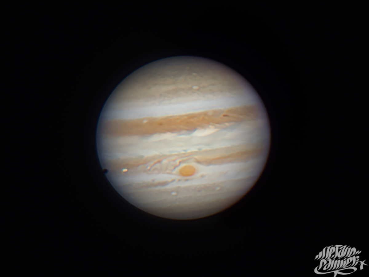 The entry of IO's shadow on Jupiter's disk