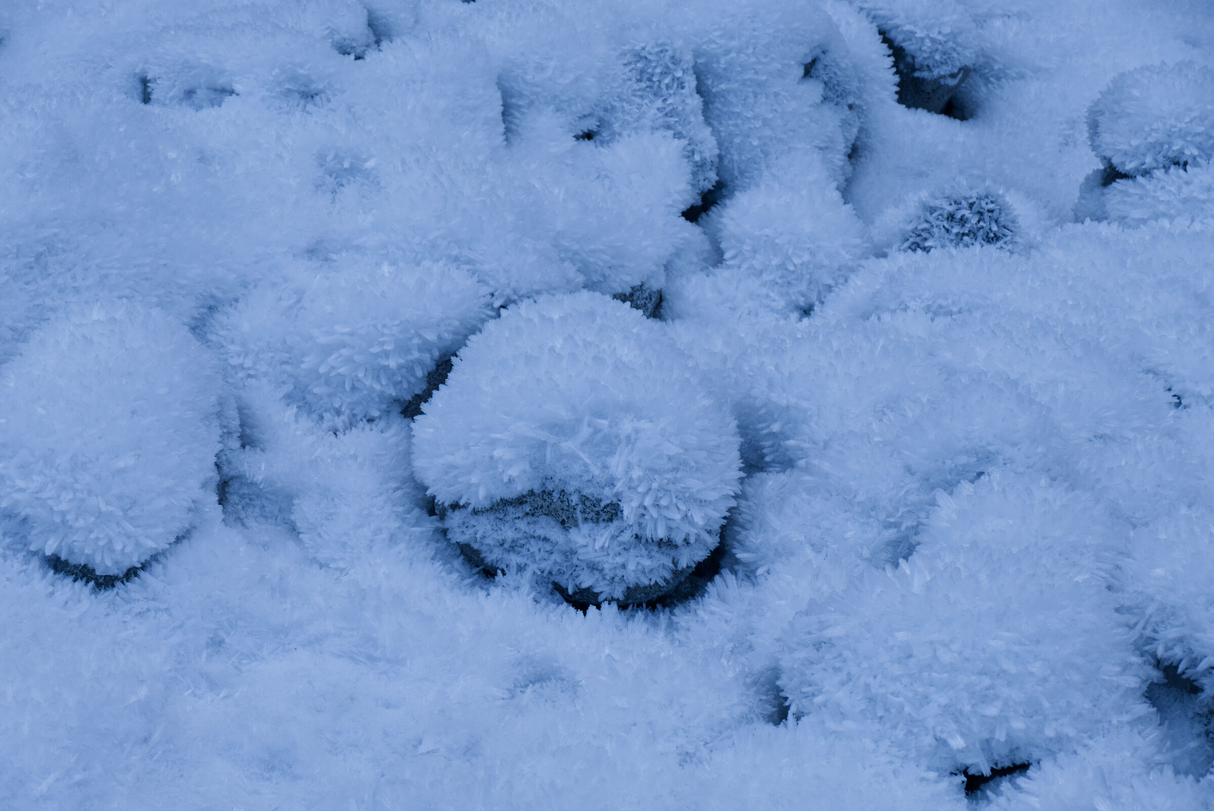 Ice crystals on river stones