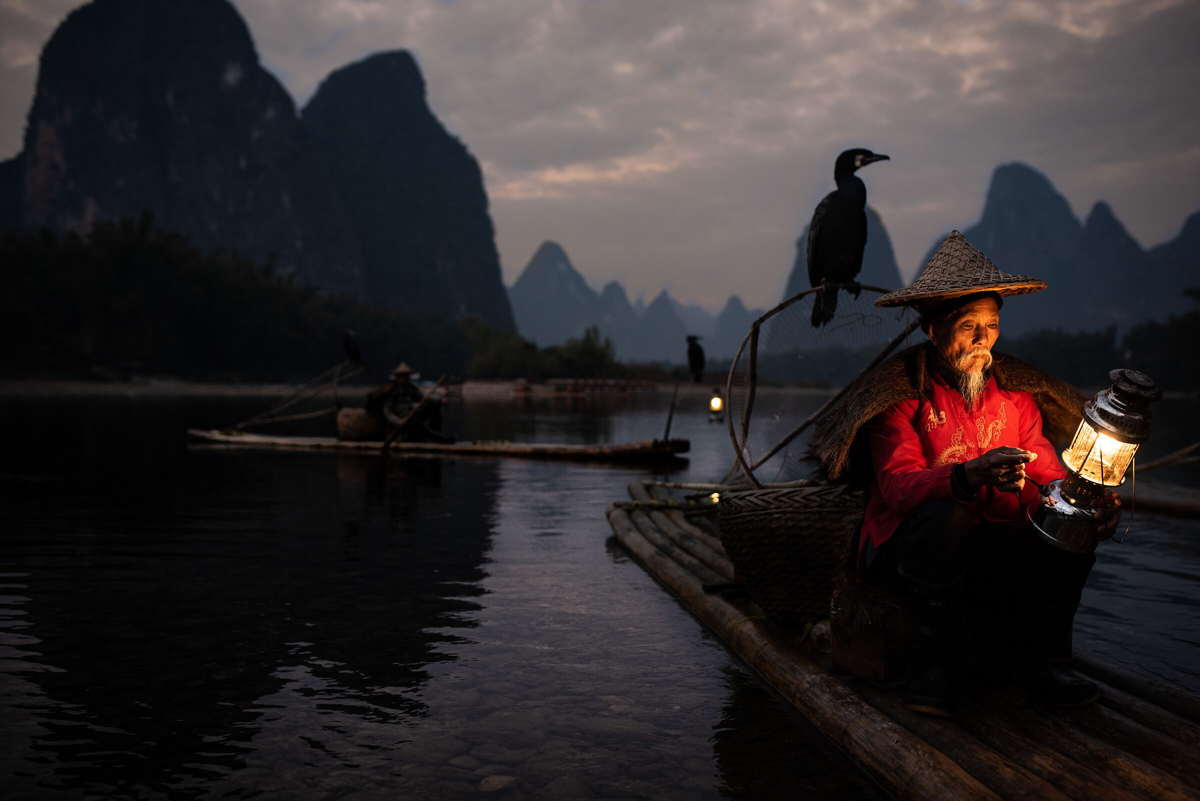 Fisherman with cormorant
