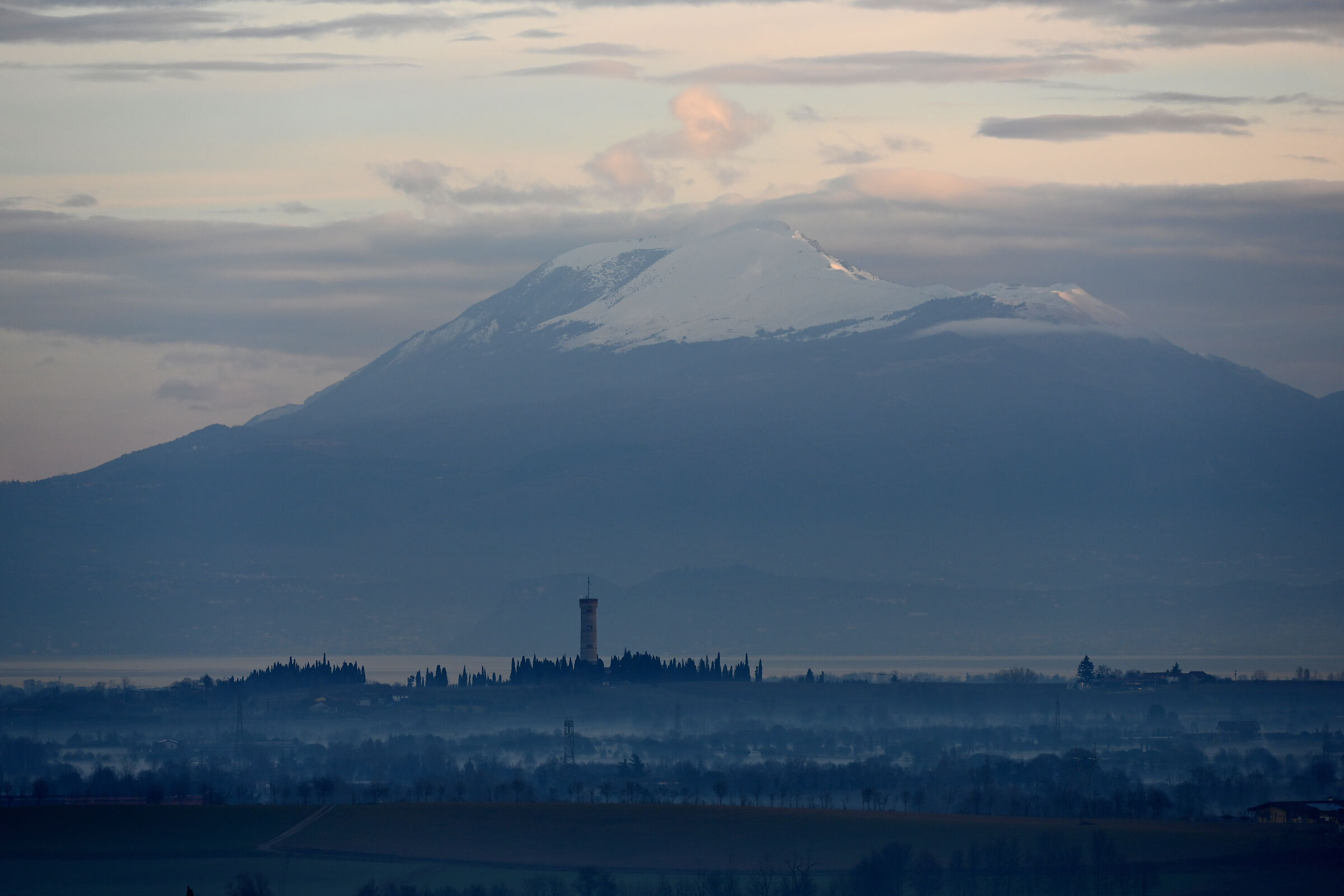 From Piazza Castello: Tower of San Martino and Monte Baldo