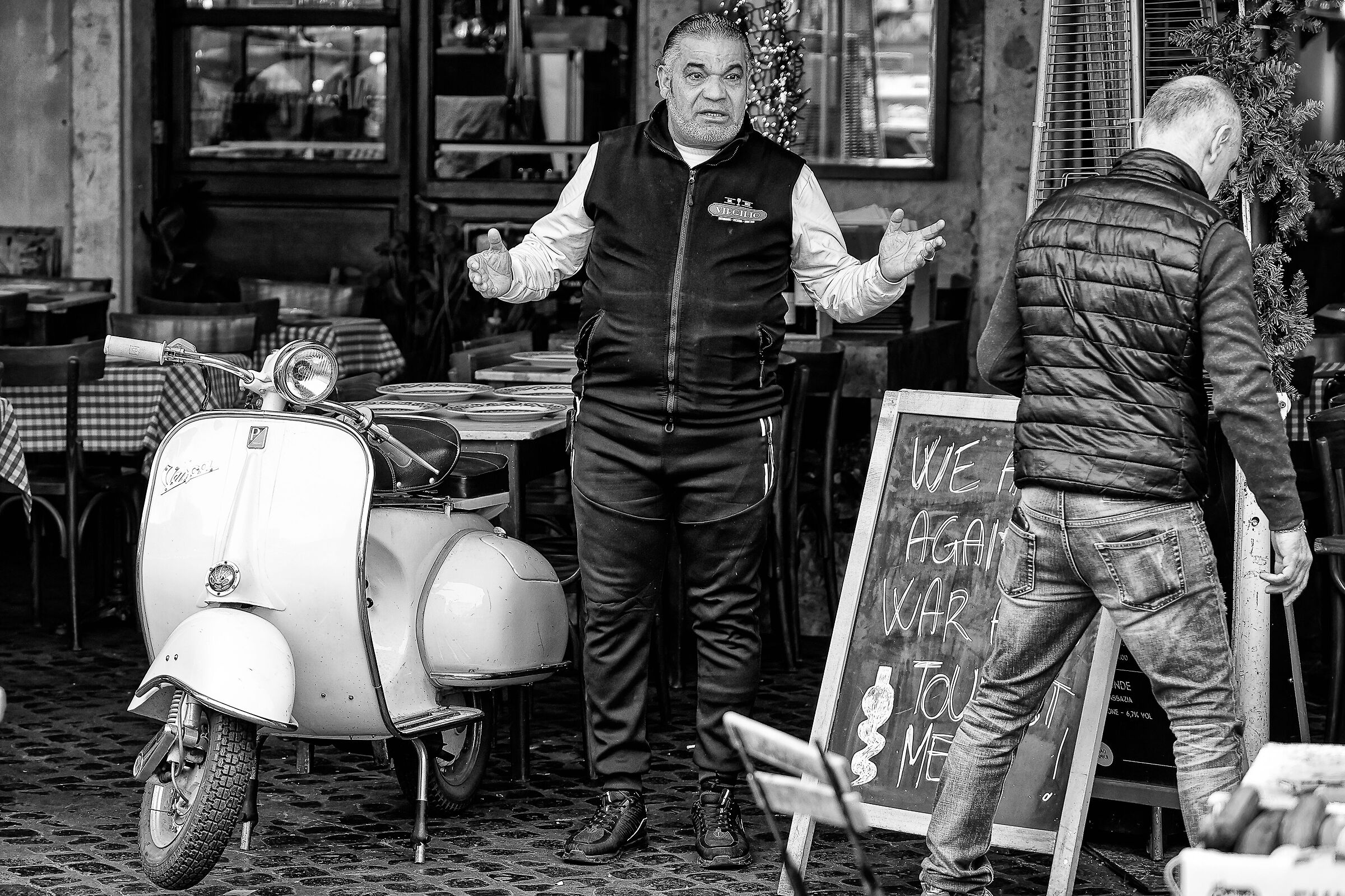 In a trattoria with a Vespa