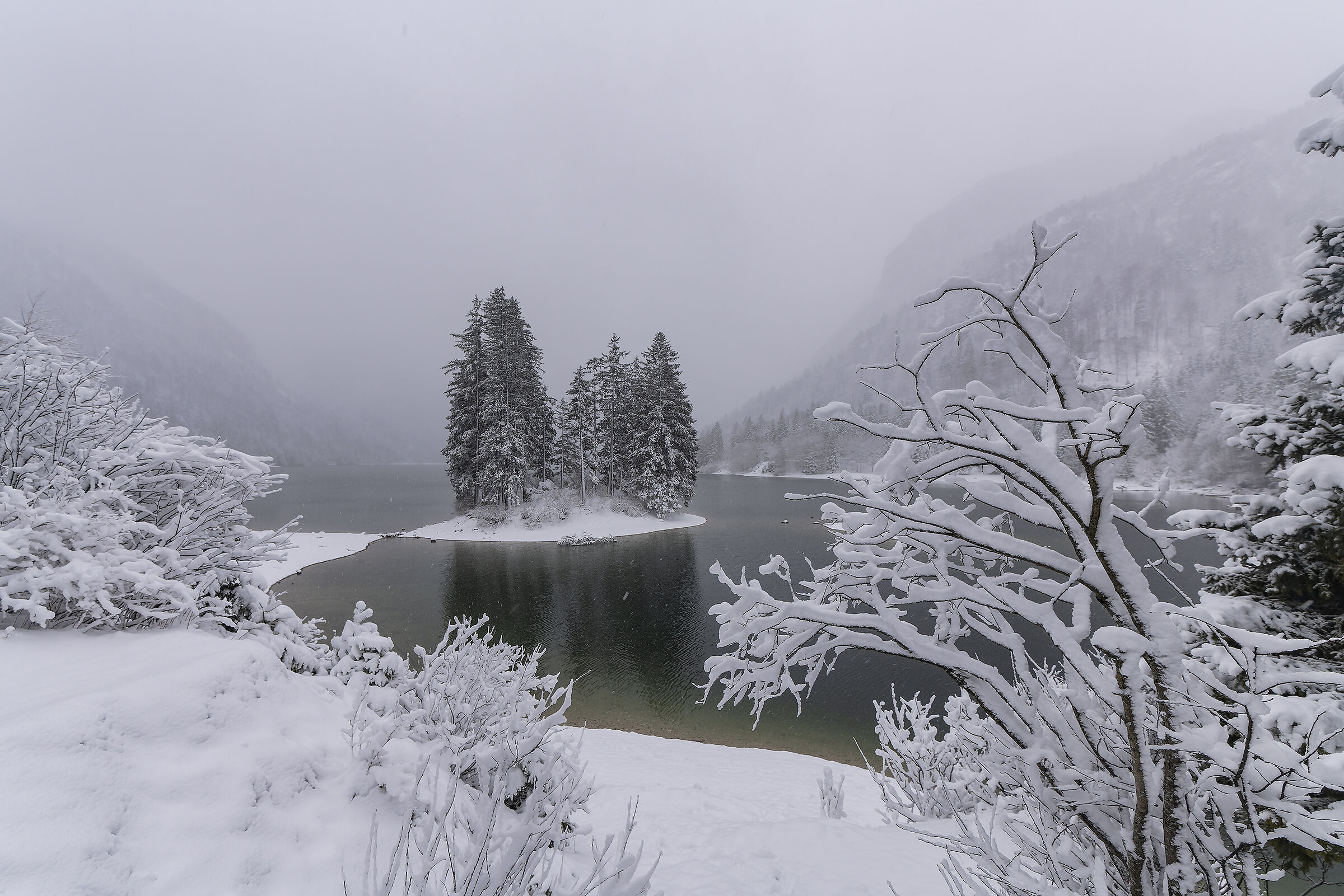 Predil quarry lake under a light snowfall