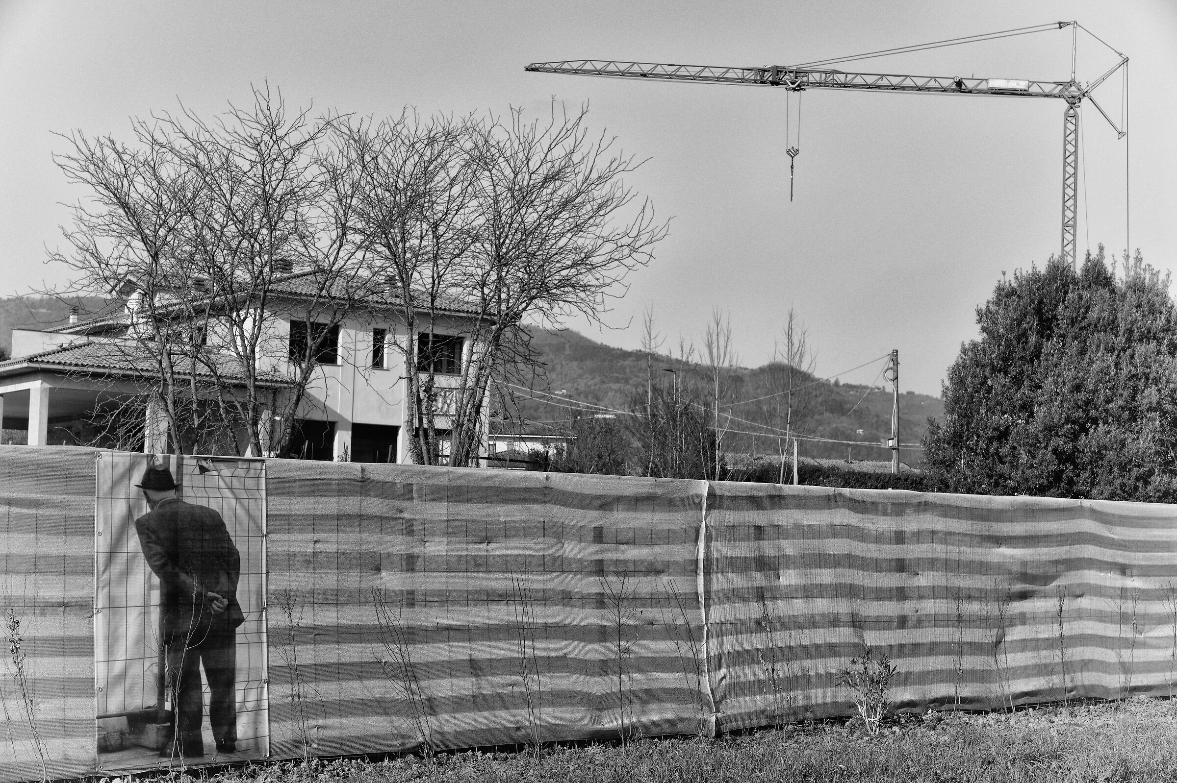Pensioner looks at the construction site