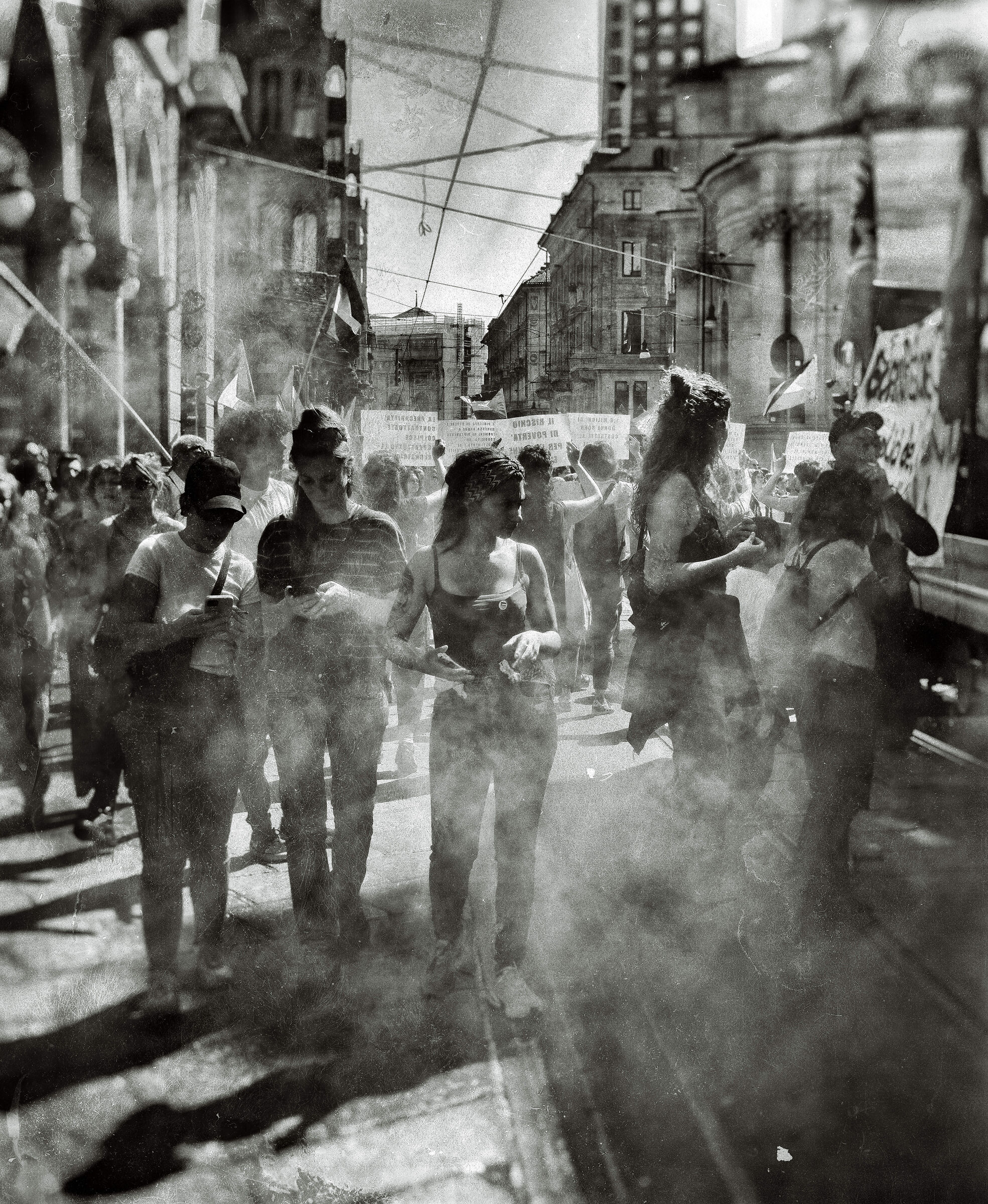 In the procession, among the smoke bombs