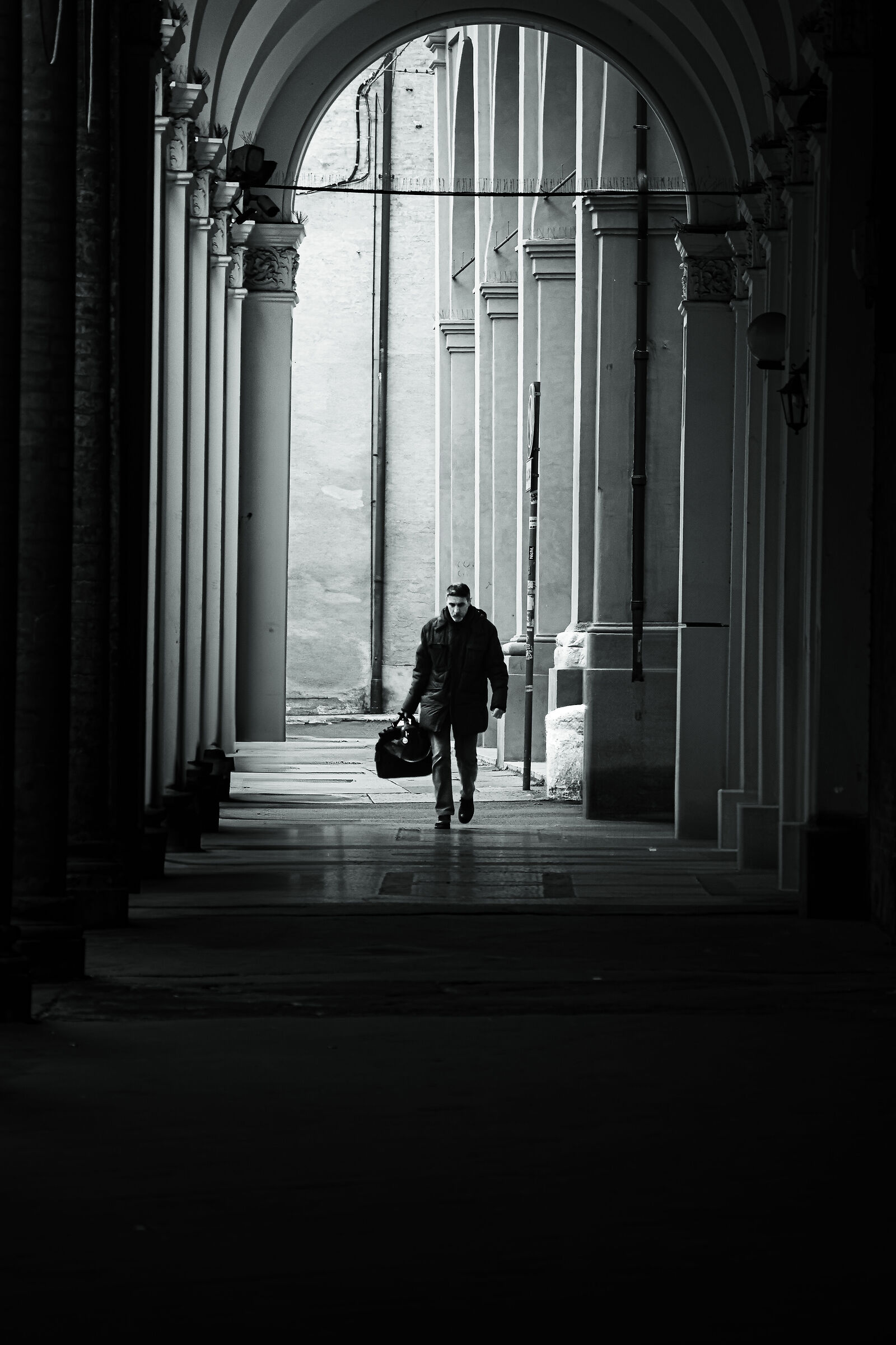 A man, a bag, and the weight of unspoken stories.
