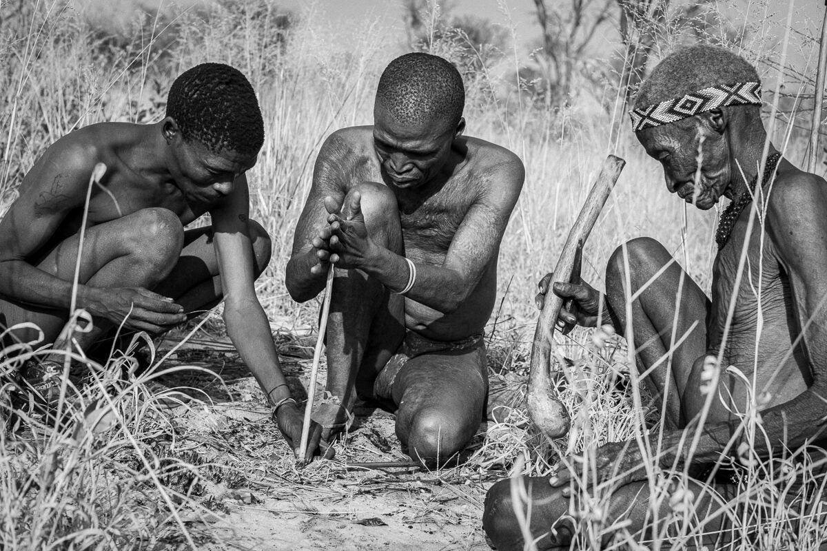 Bushman hunters light the fire