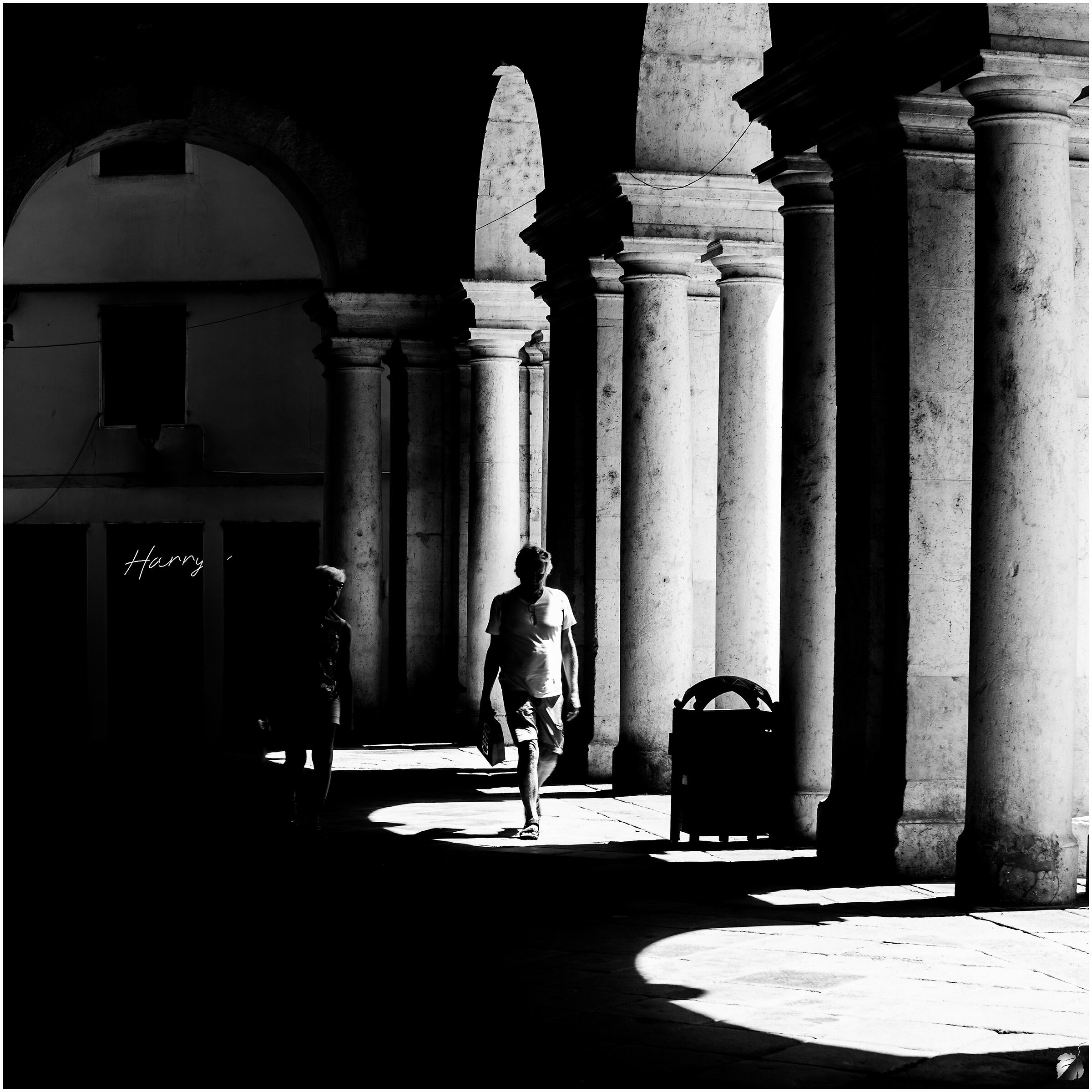 Tourists under the Palladian basilica Vicenza