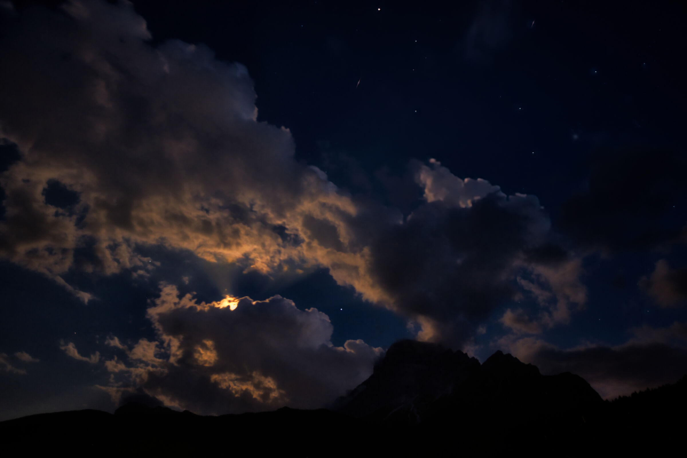 The moon sets behind the Pelmo