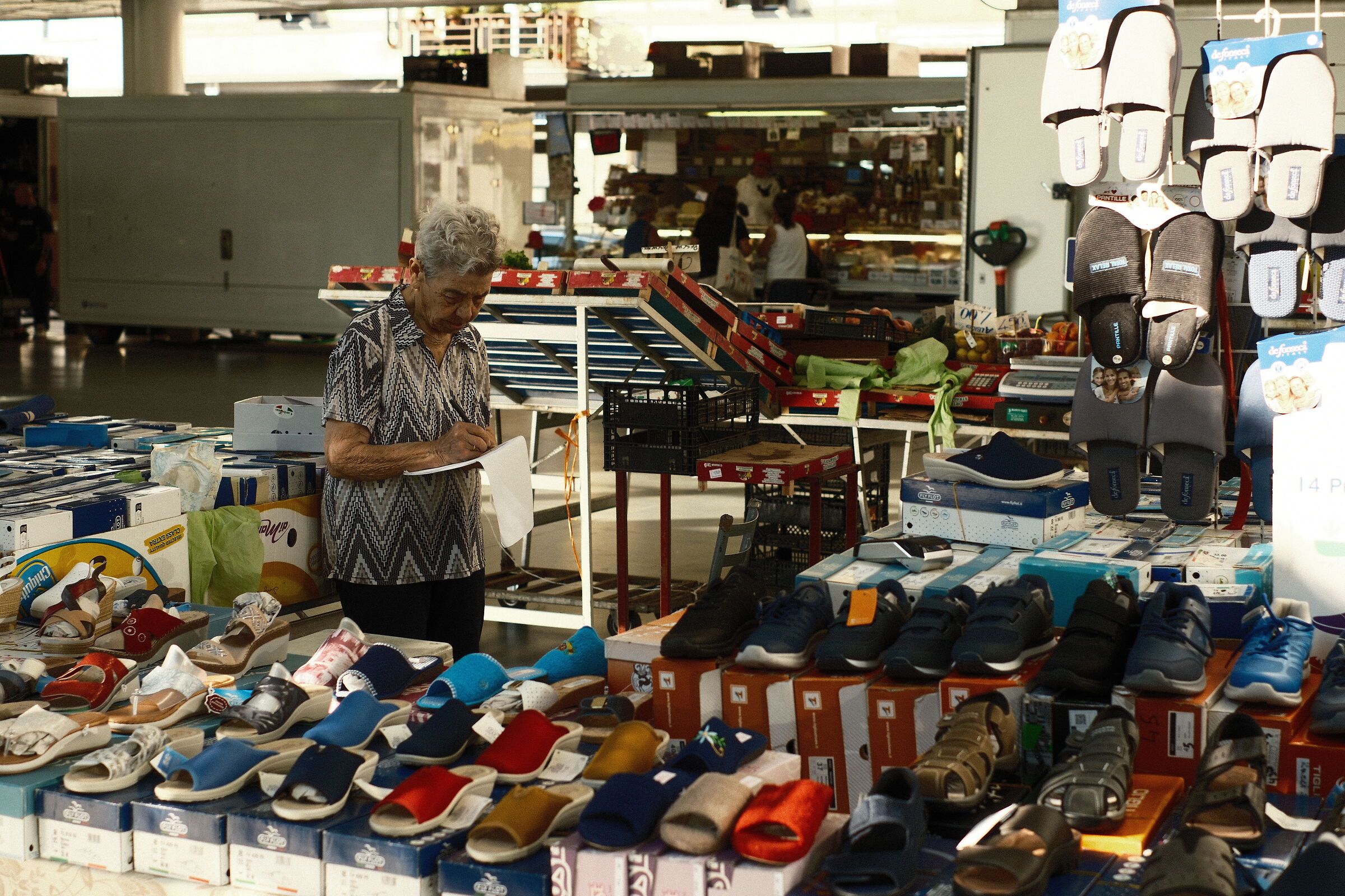Lady selling slippers