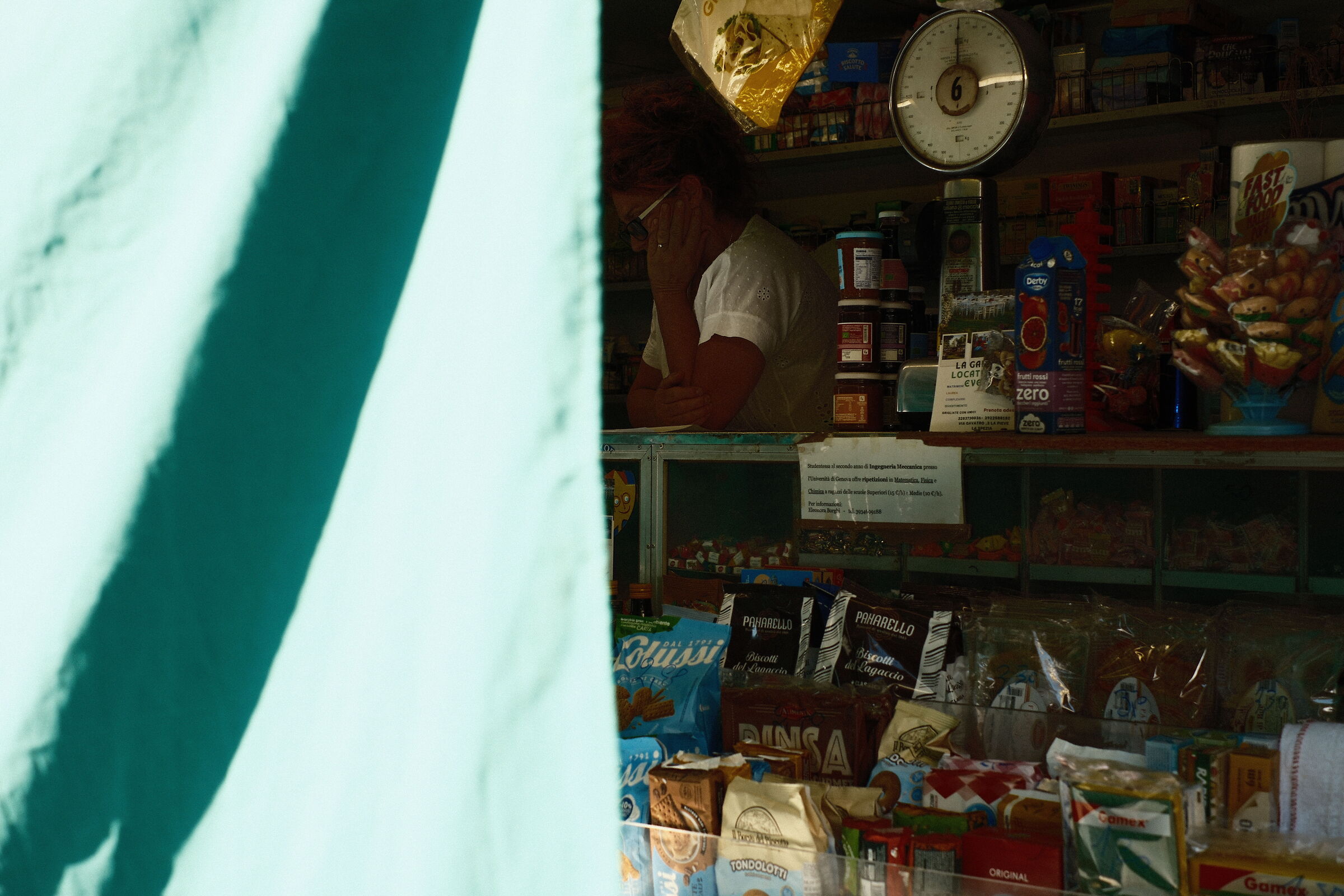 Saleswoman behind the curtain