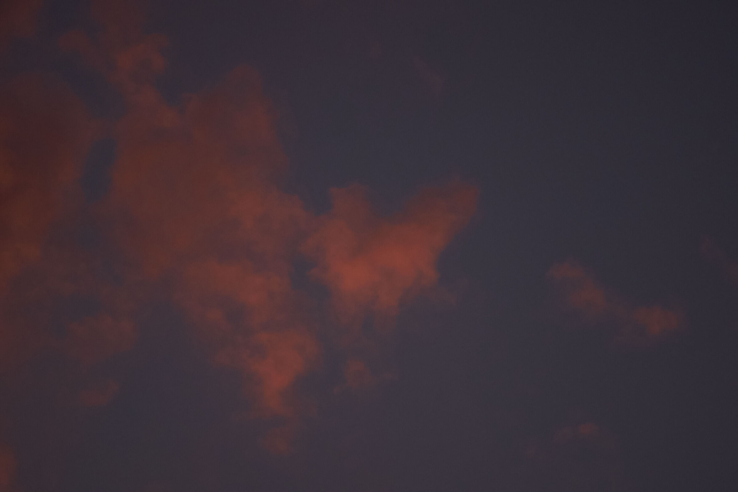 Red clouds in blue sky 2