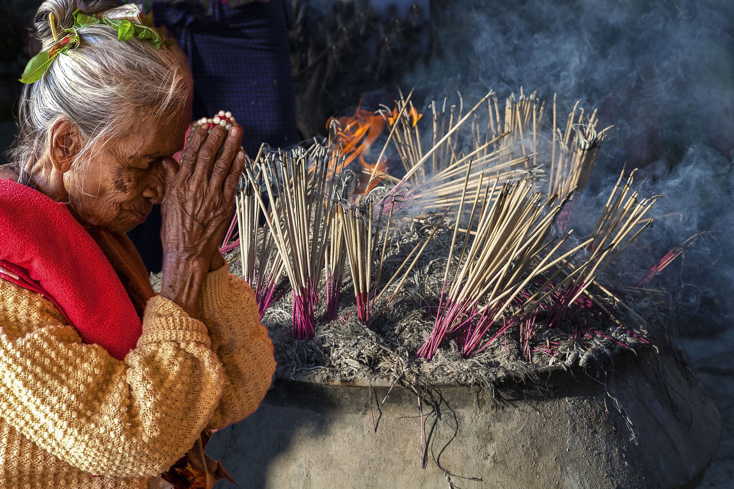 Myanmar, woman in prayer
