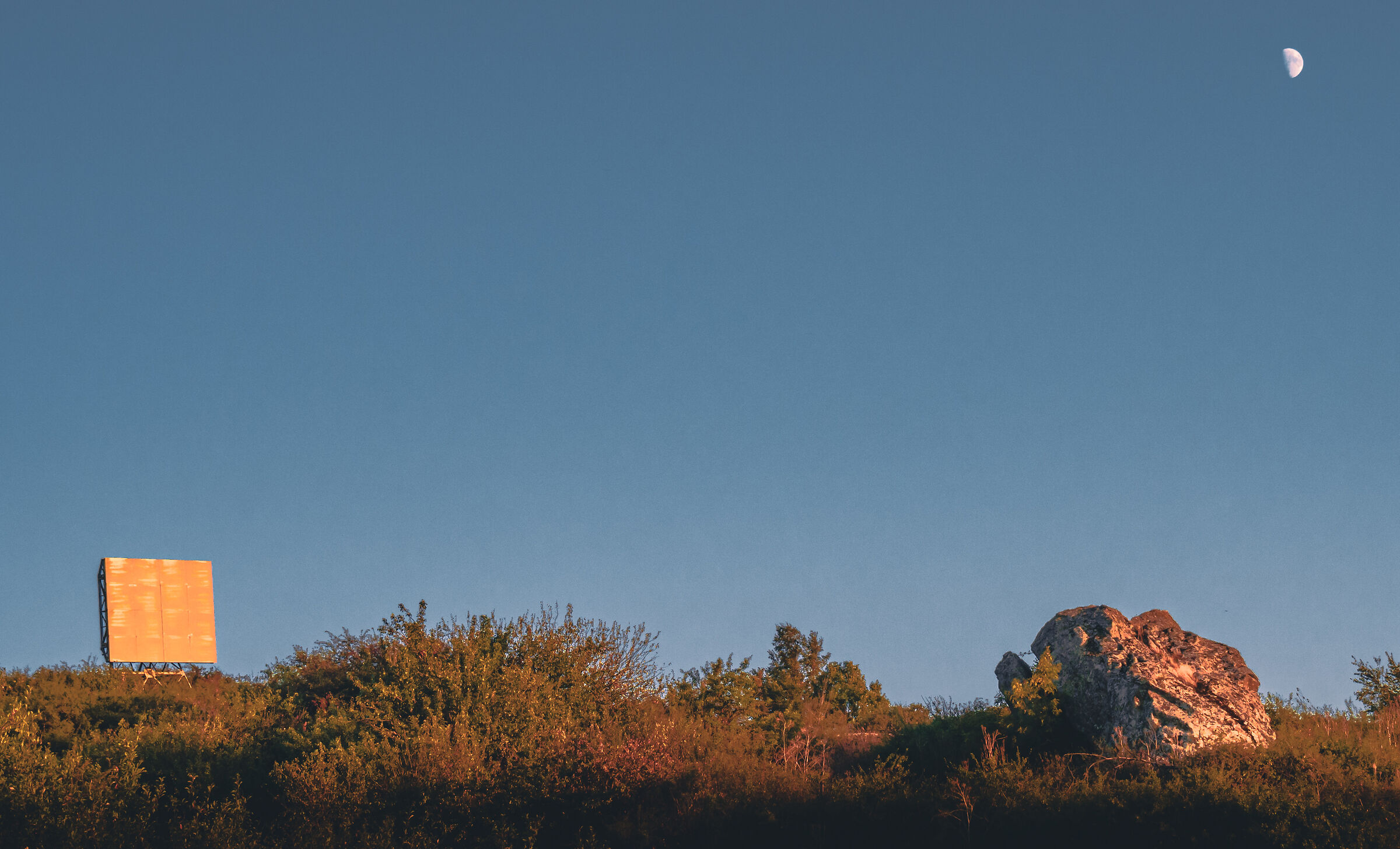 Sunlight over Billboard, Rock, and Moon