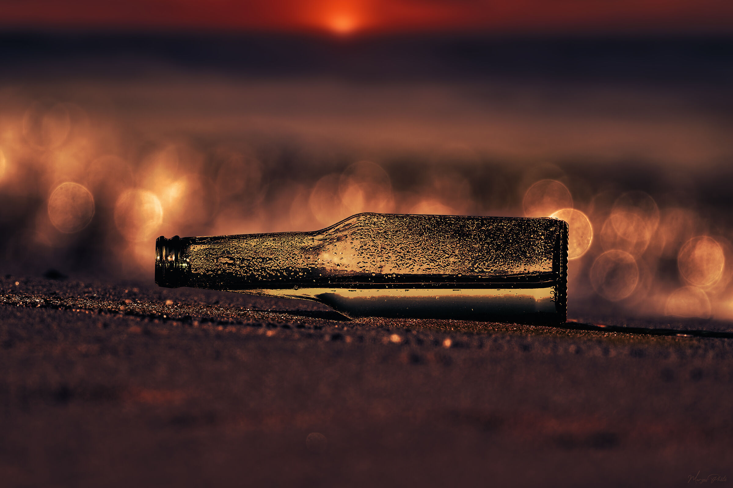 A bottle at sunset