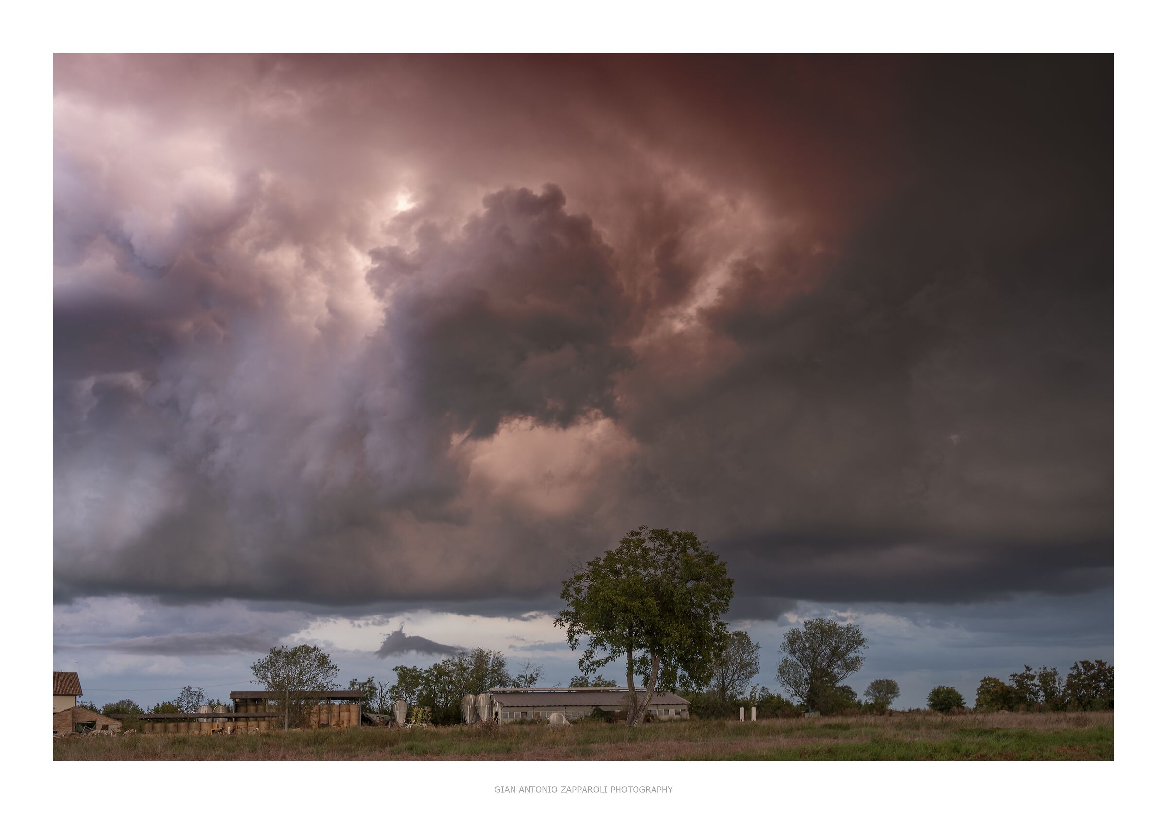 Storm cell illuminated by continuous lightning