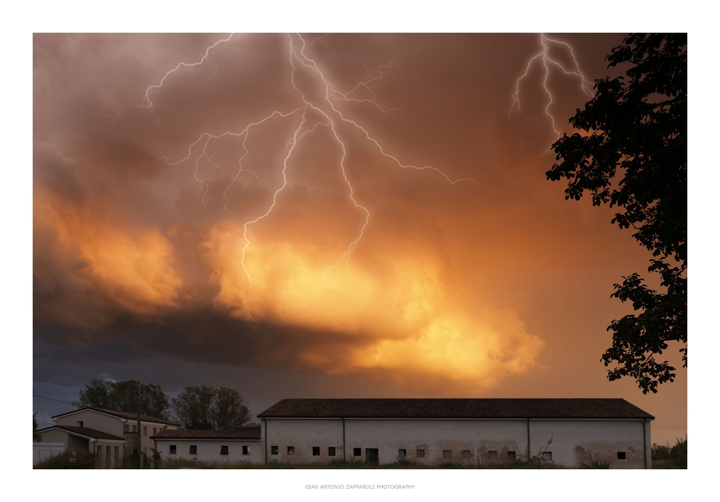 Storm cell illuminated by continuous lightning