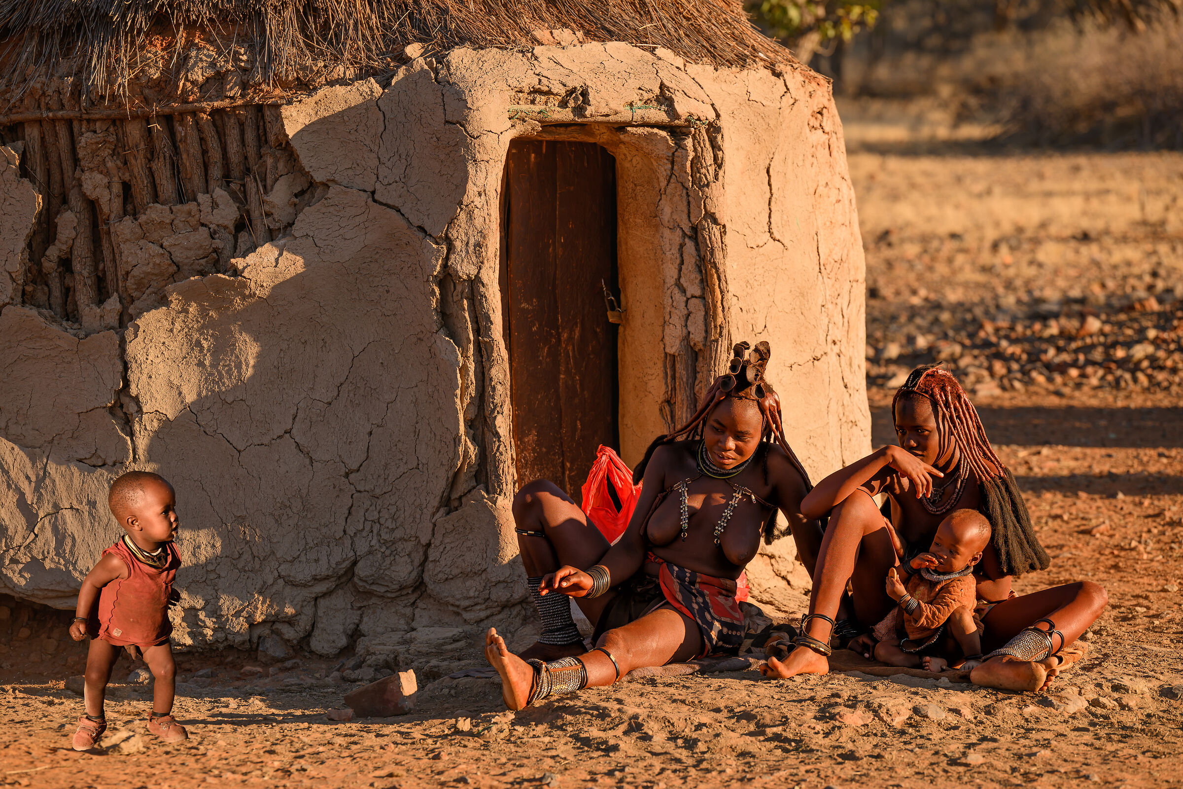 Two Young Himba Moms With Children