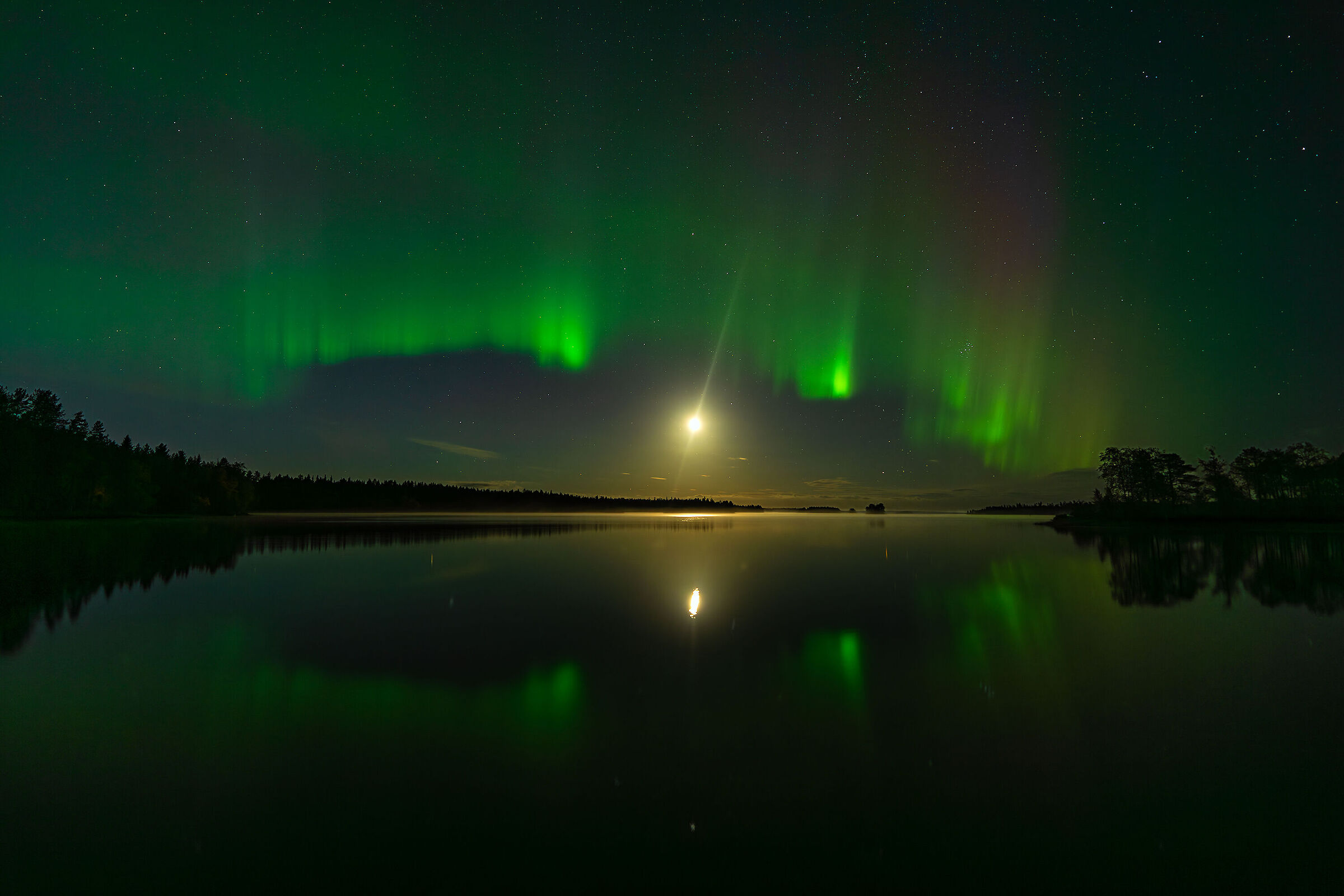 Aurora and moon at the lake , Finland