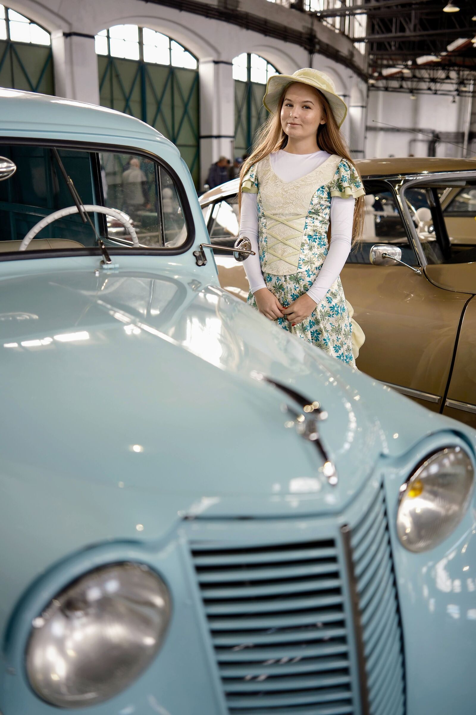 A timeless charm blooms as she stands gracefully