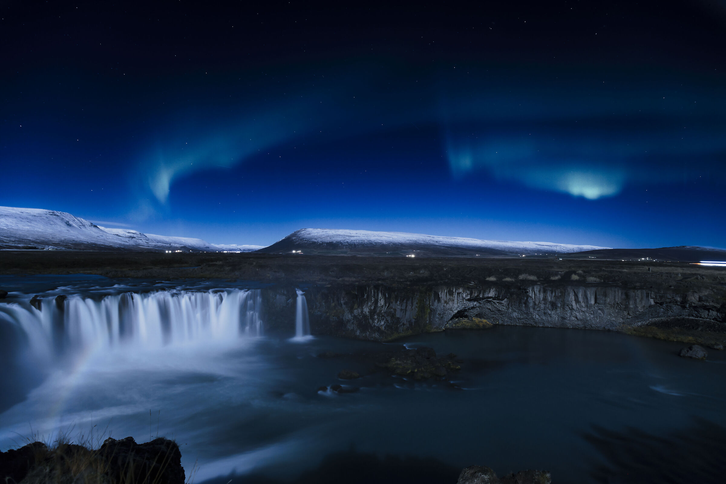 Goðafoss between a lunar rainbow and a small aurora