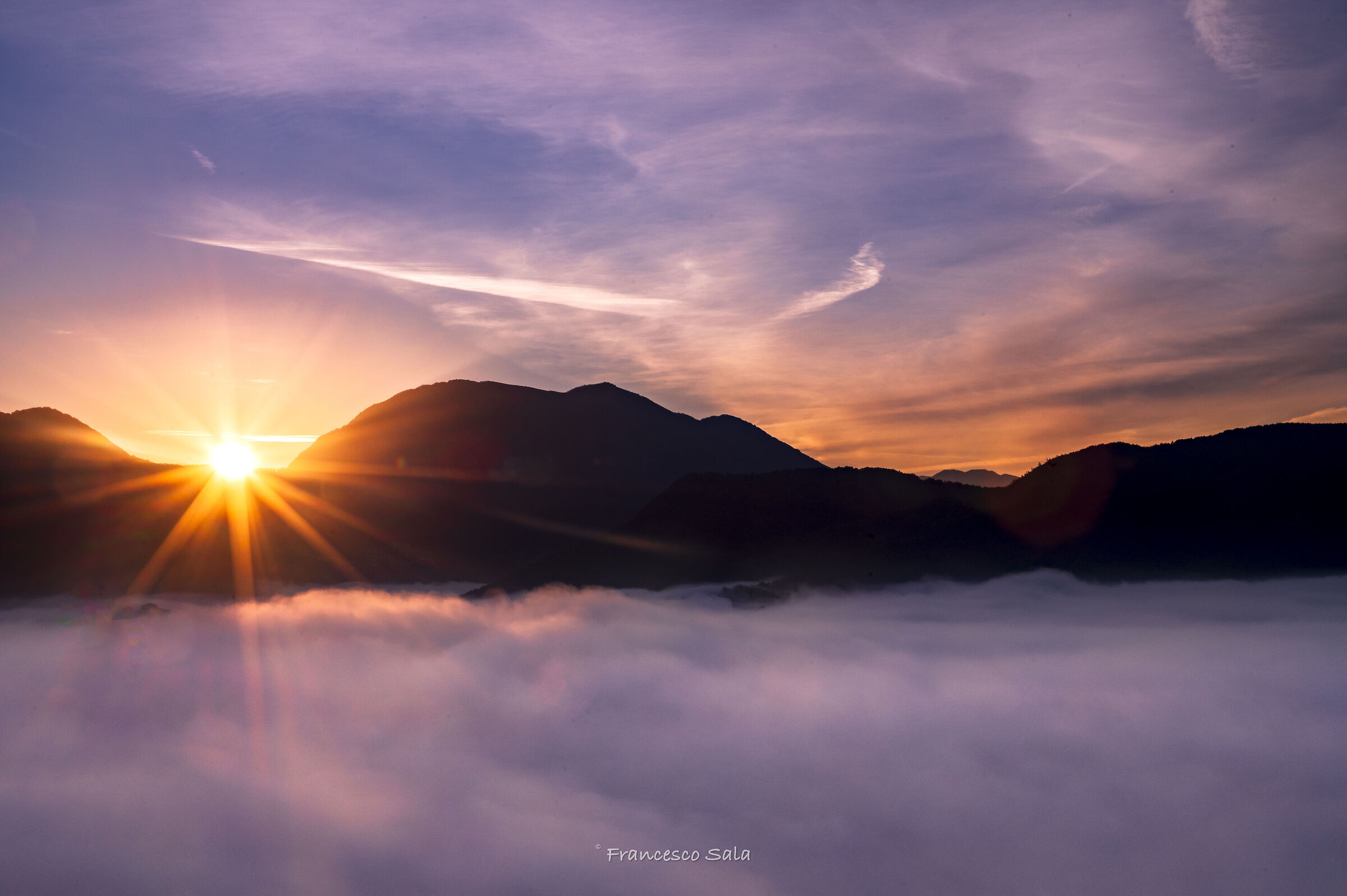 Sunrise over lake of fog