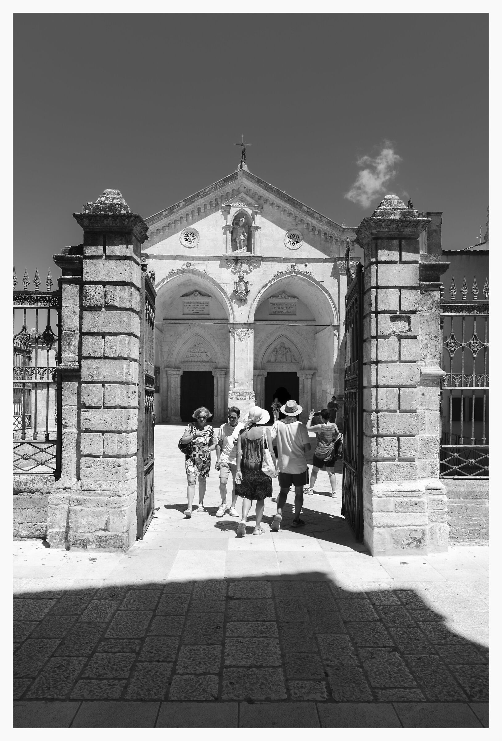 The faithful come and go in the Sanctuary of San Michele