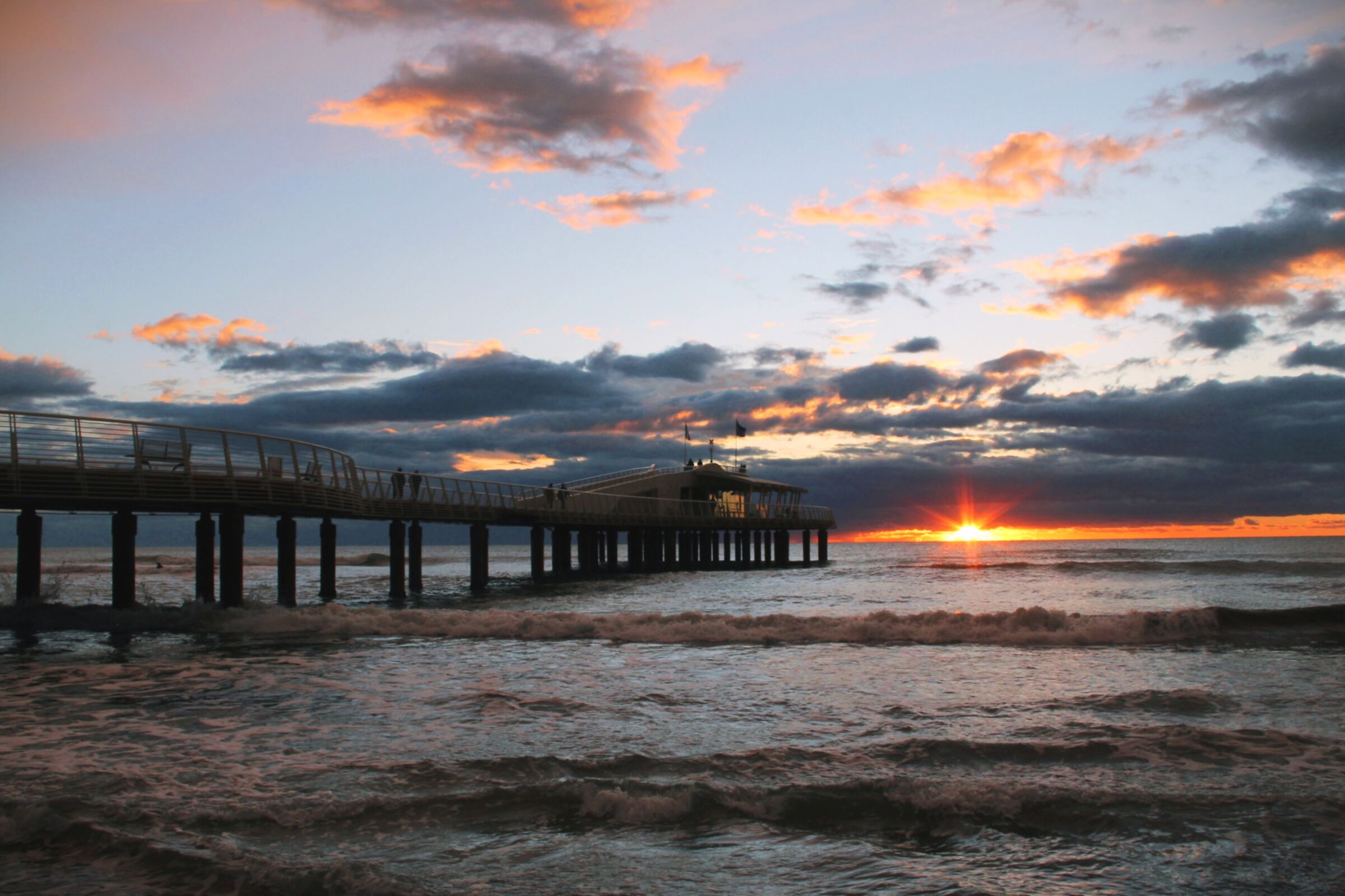 Sunset on the pier with the sun