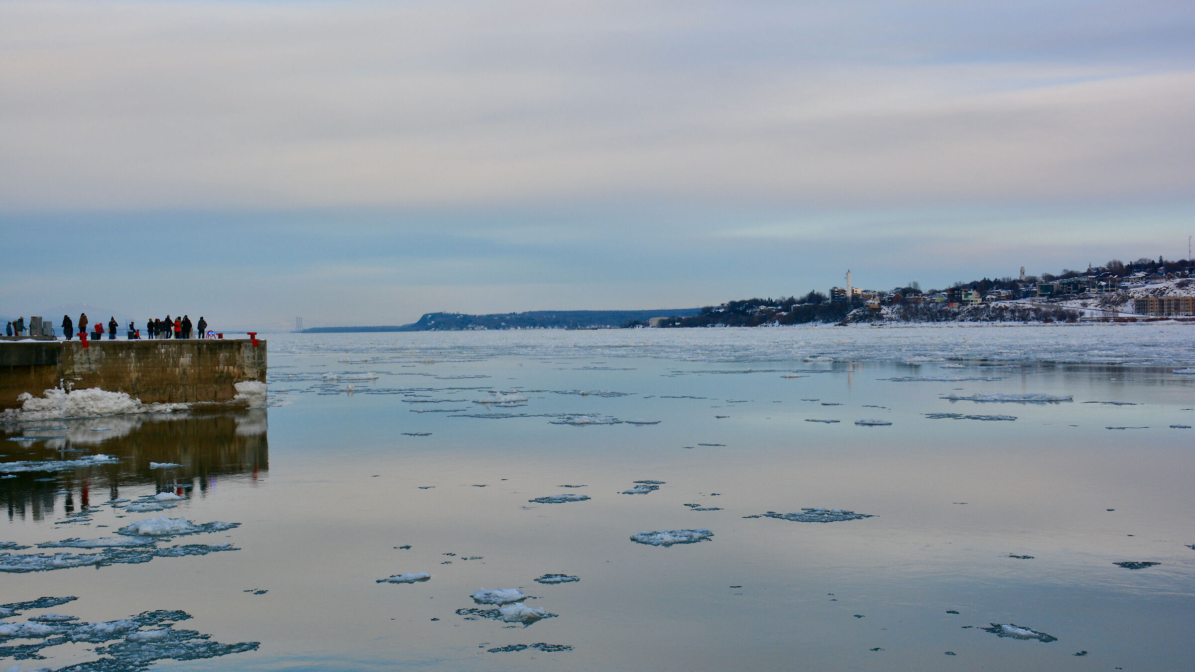 St. Lawrence River with ice and colorful reflections