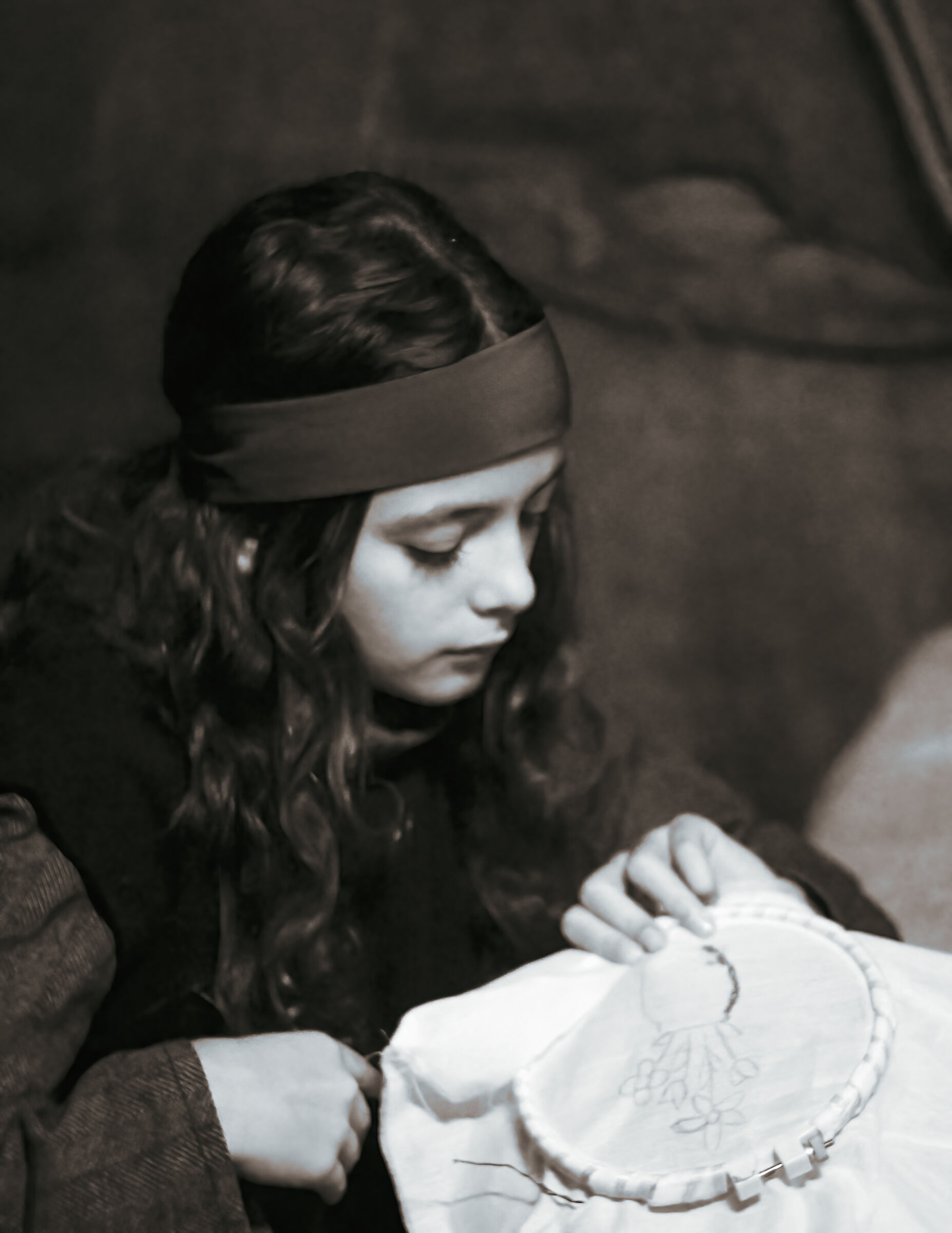 Little girl embroidering