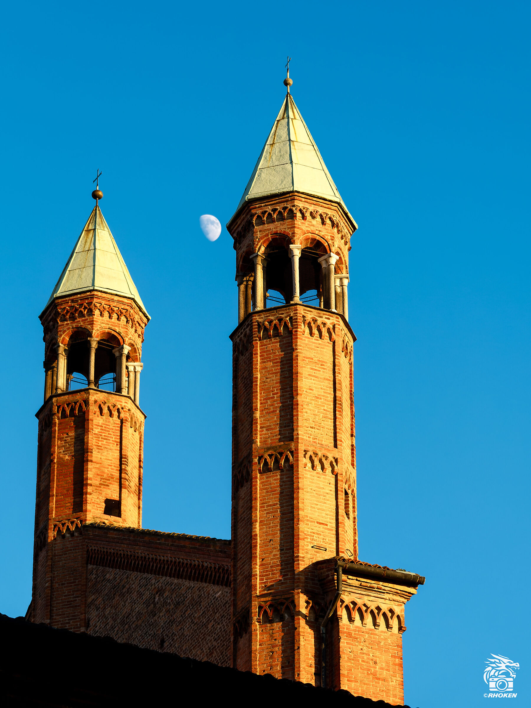The moon between two towers