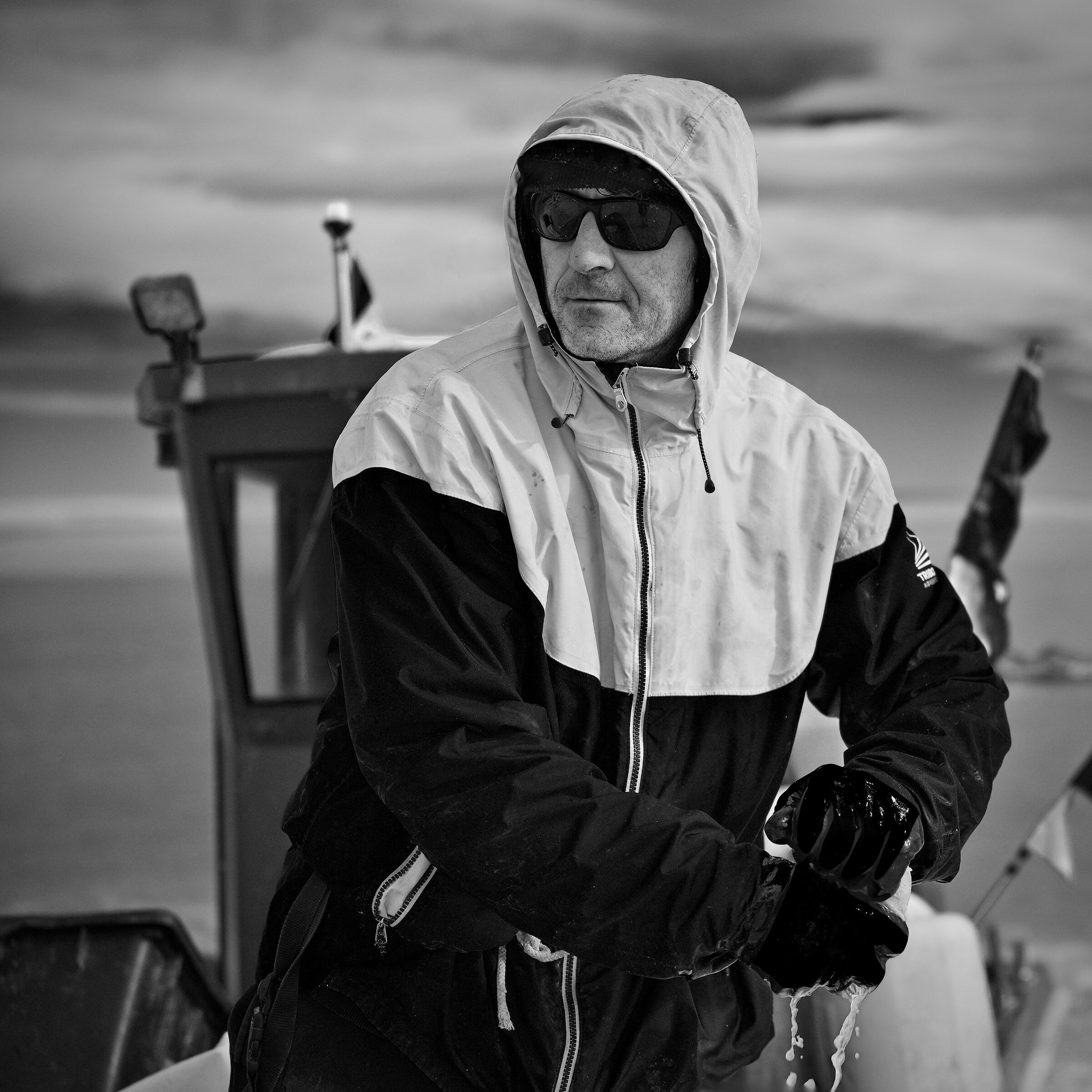 Fisherman tidying up boat