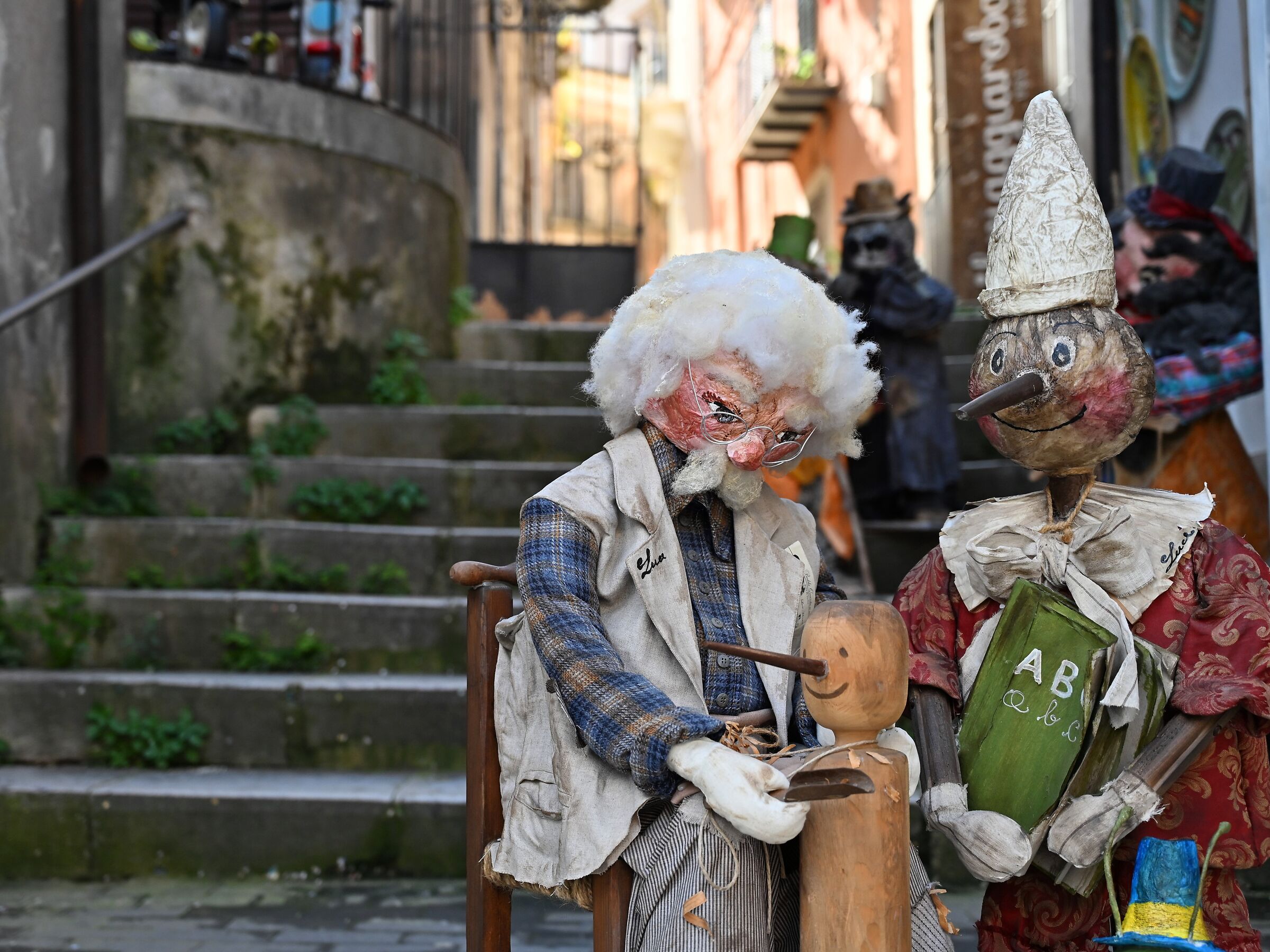 Geppetto teaches the trade to Pinocchio (Modica)