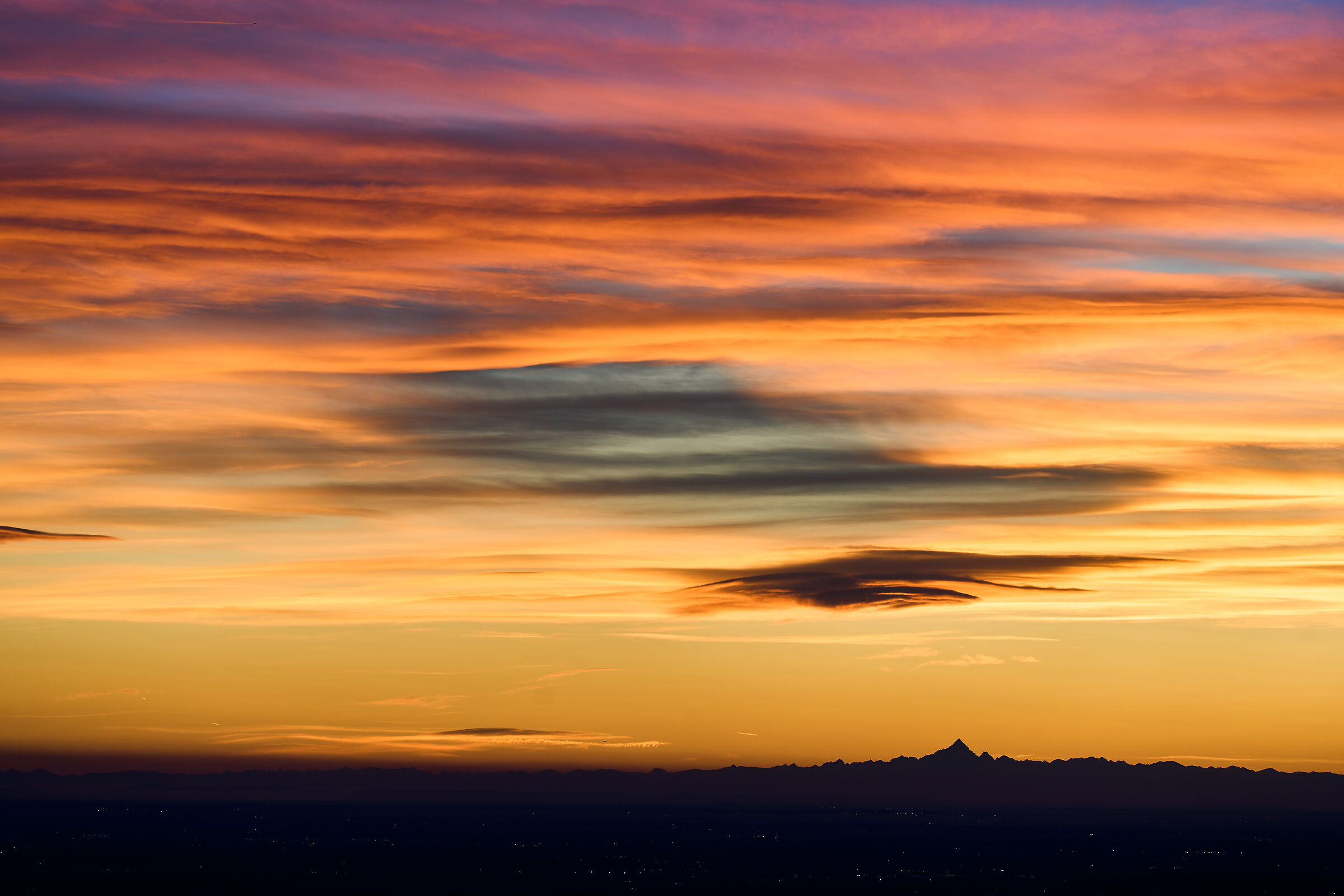 The sunset and its clouds
