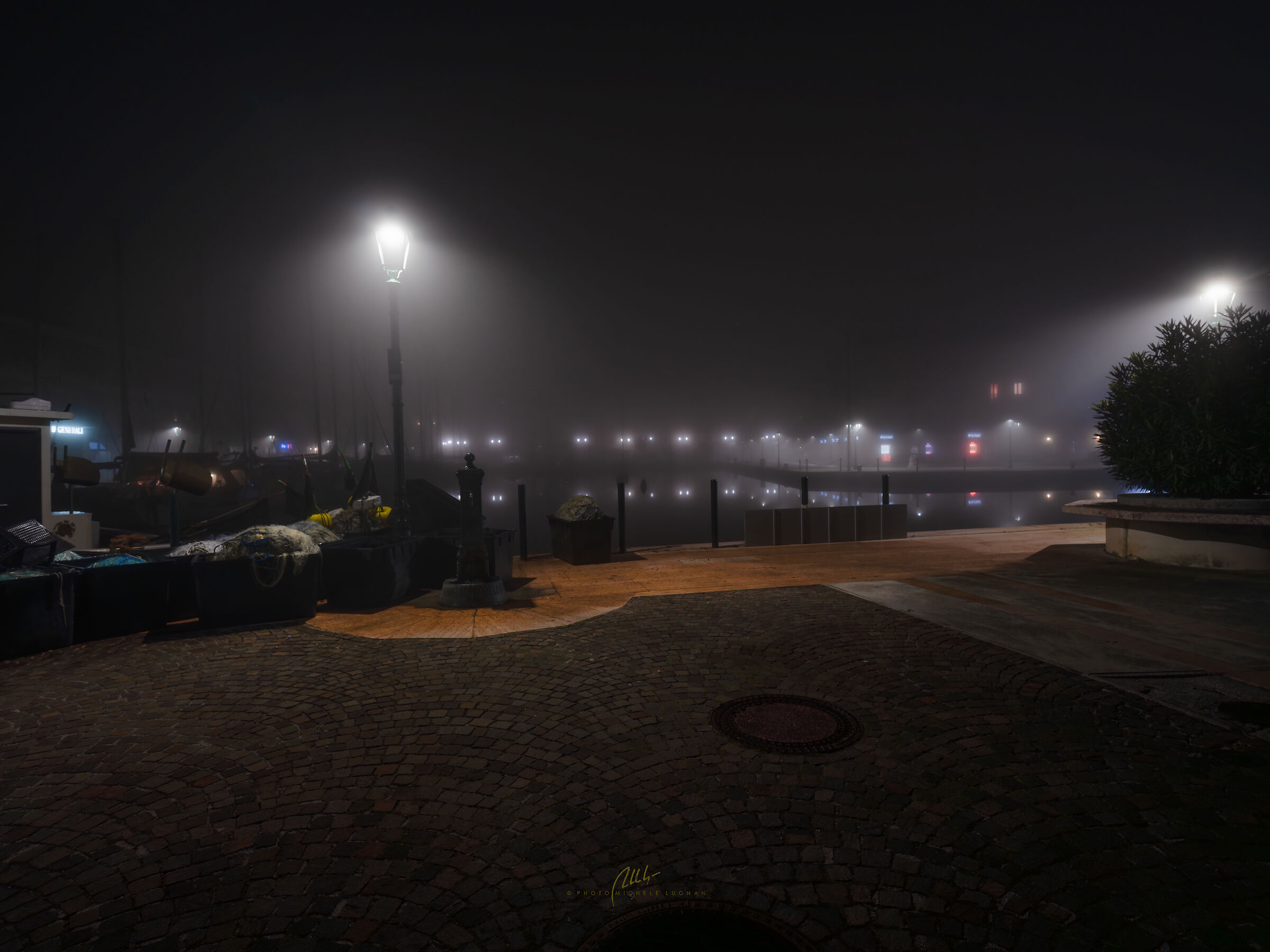 The port of Grado in the fog