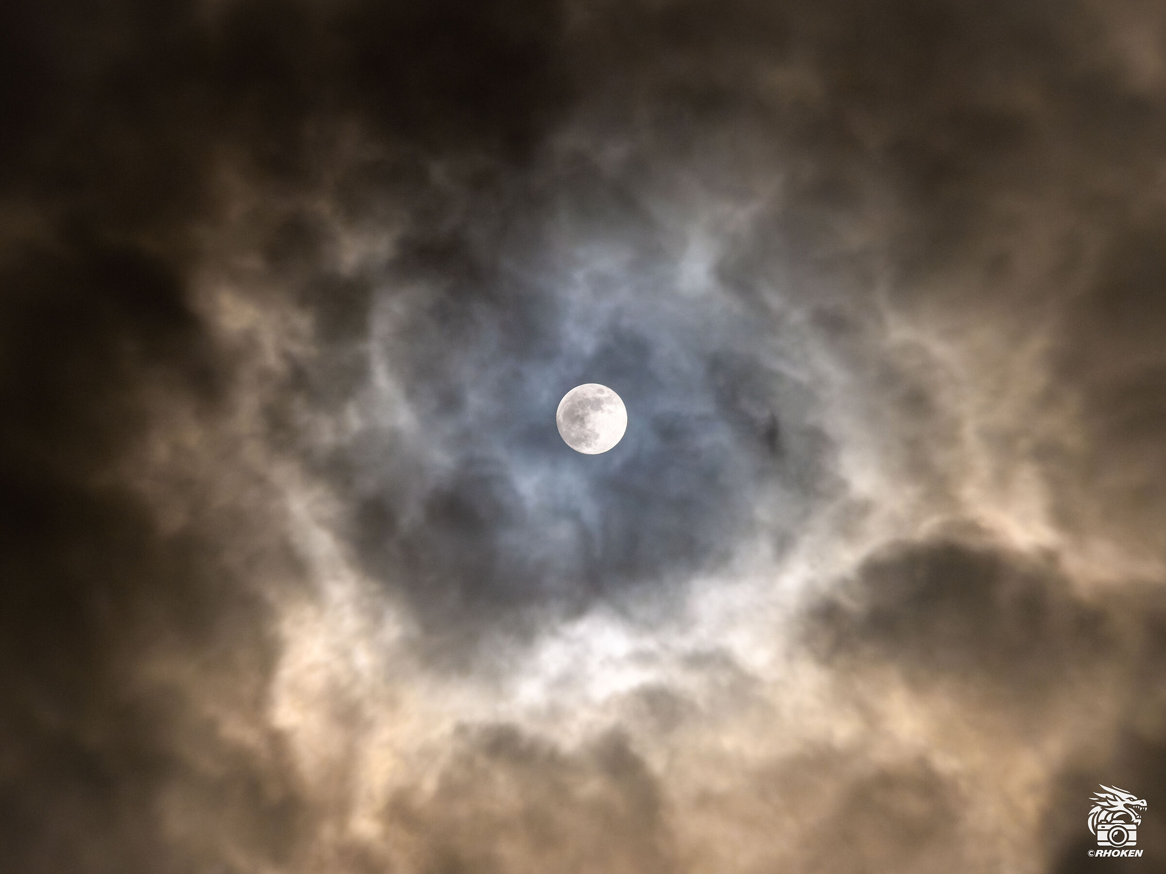 The Moon makes its way through the clouds