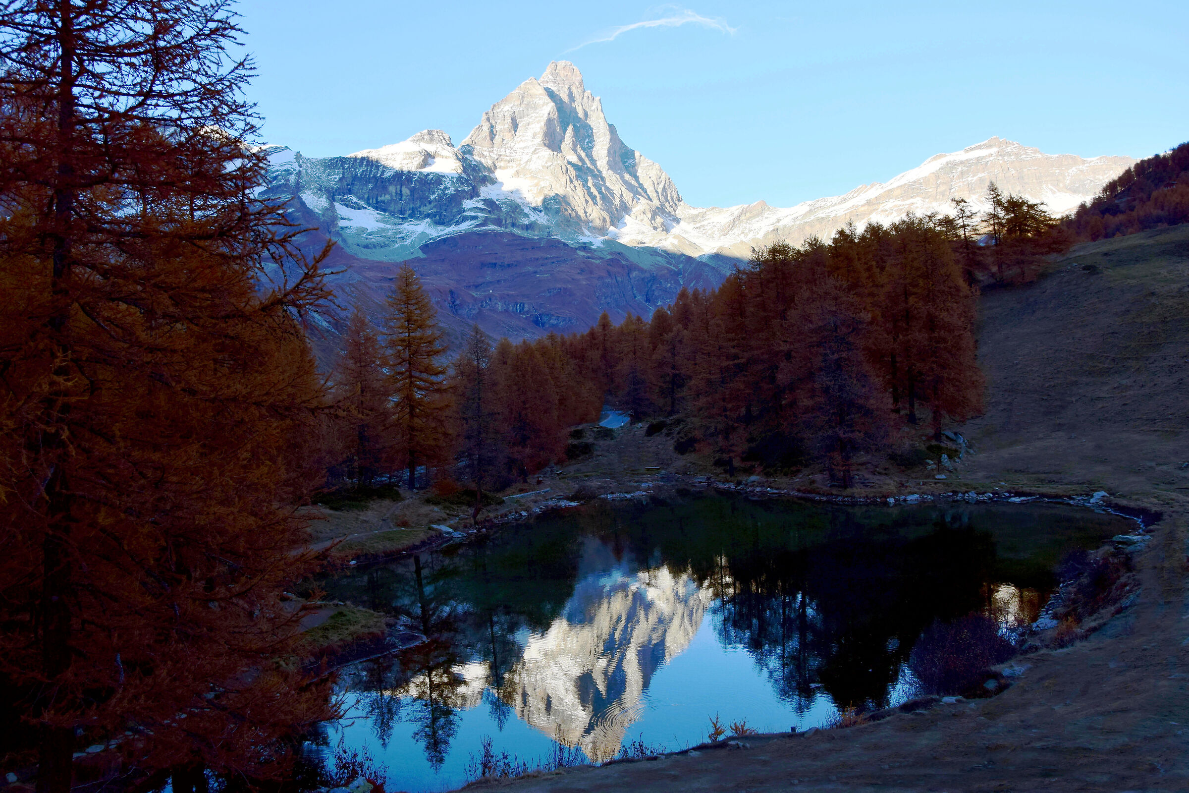 The Matterhorn is reflected in the blue lake