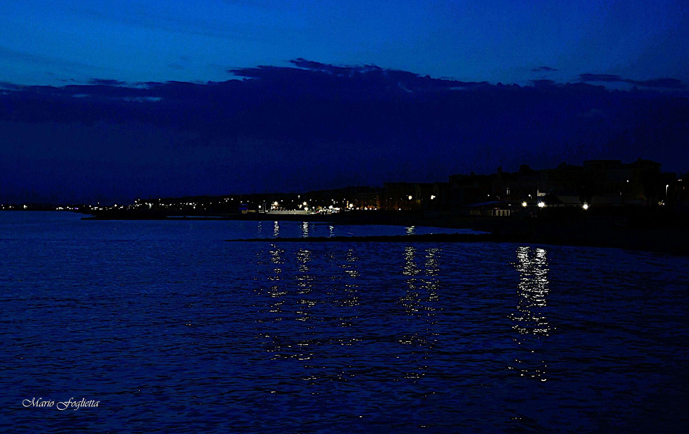 When night falls and the sea shimmers
