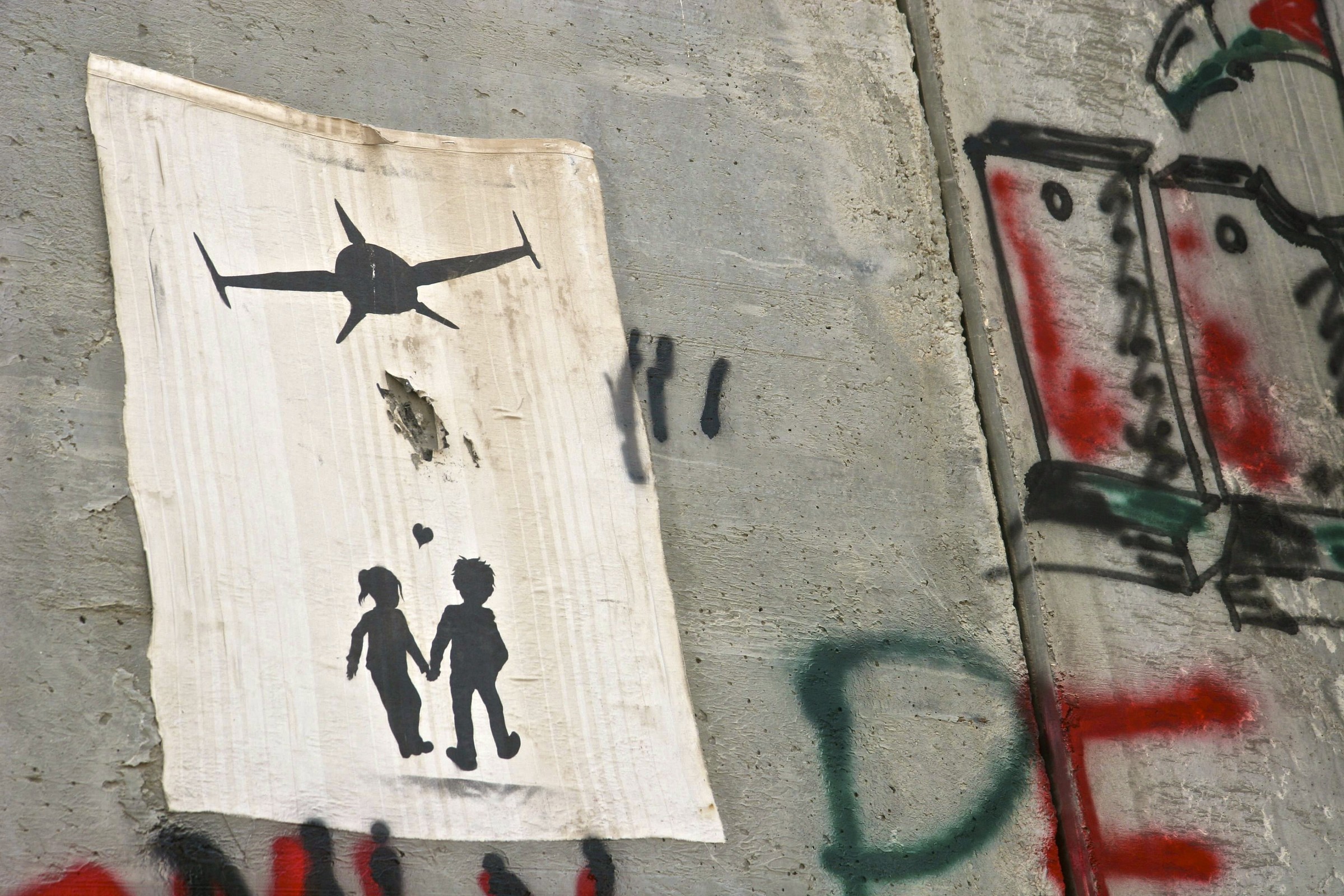 Poster sul muro di separazione (west bank)