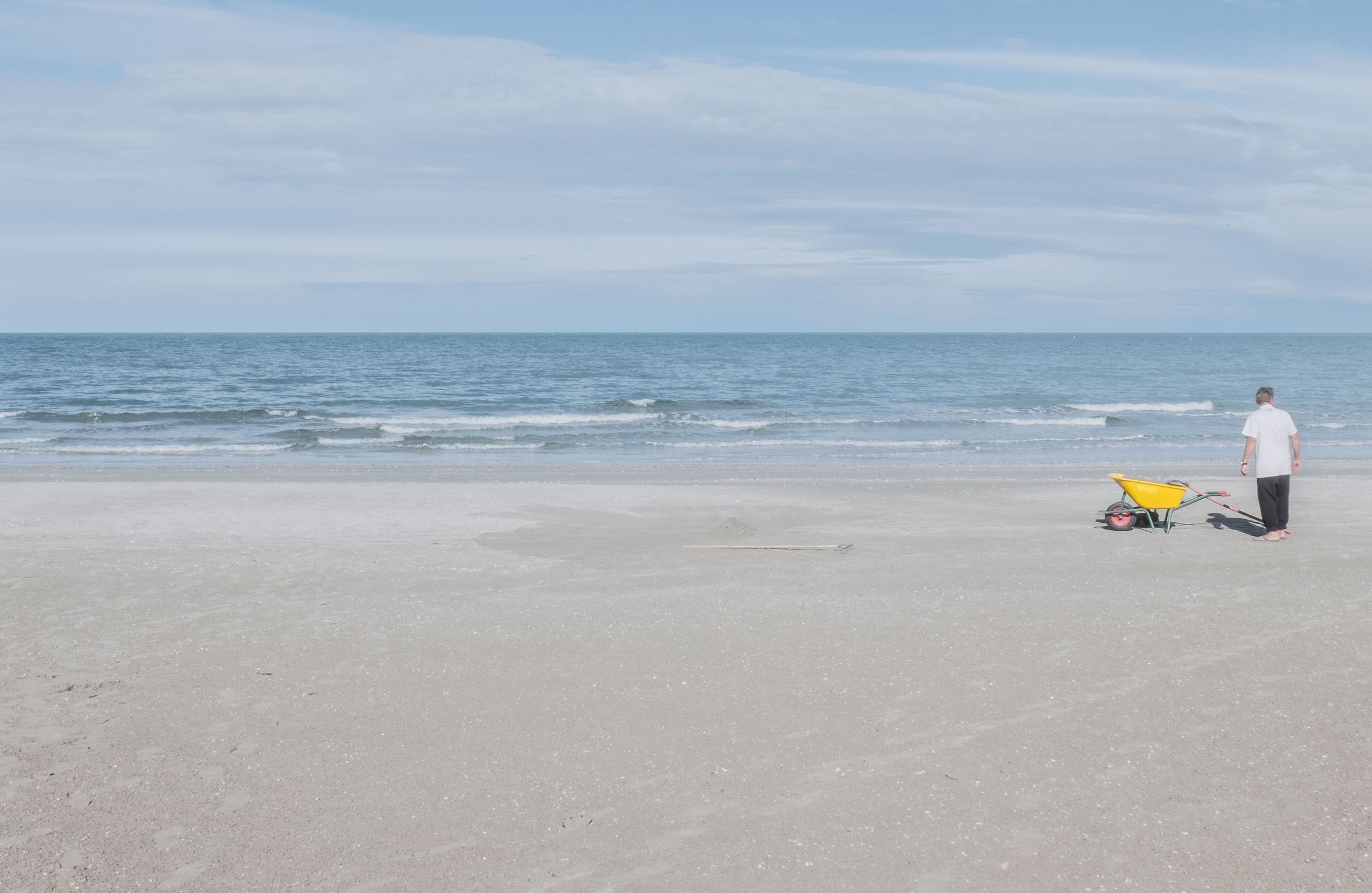 The man with the yellow wheelbarrow