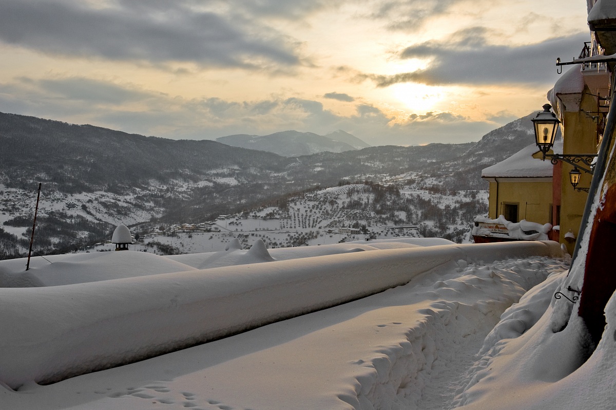 Sunset on snowy village