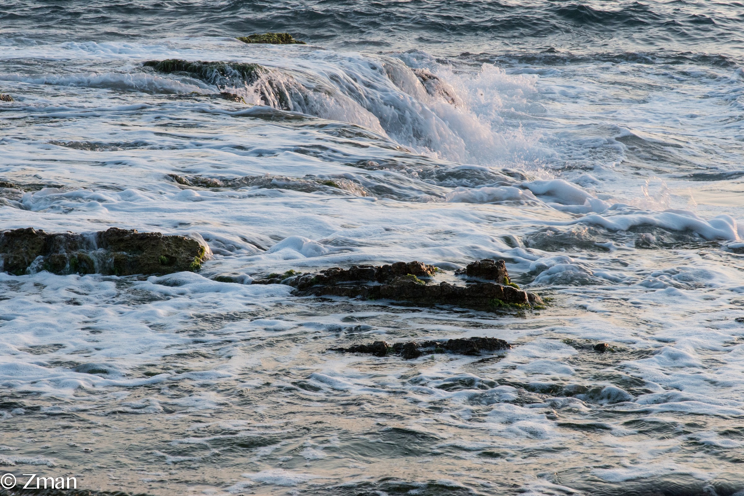 The Alrawshe shore line. Waves breaking on the Rocks