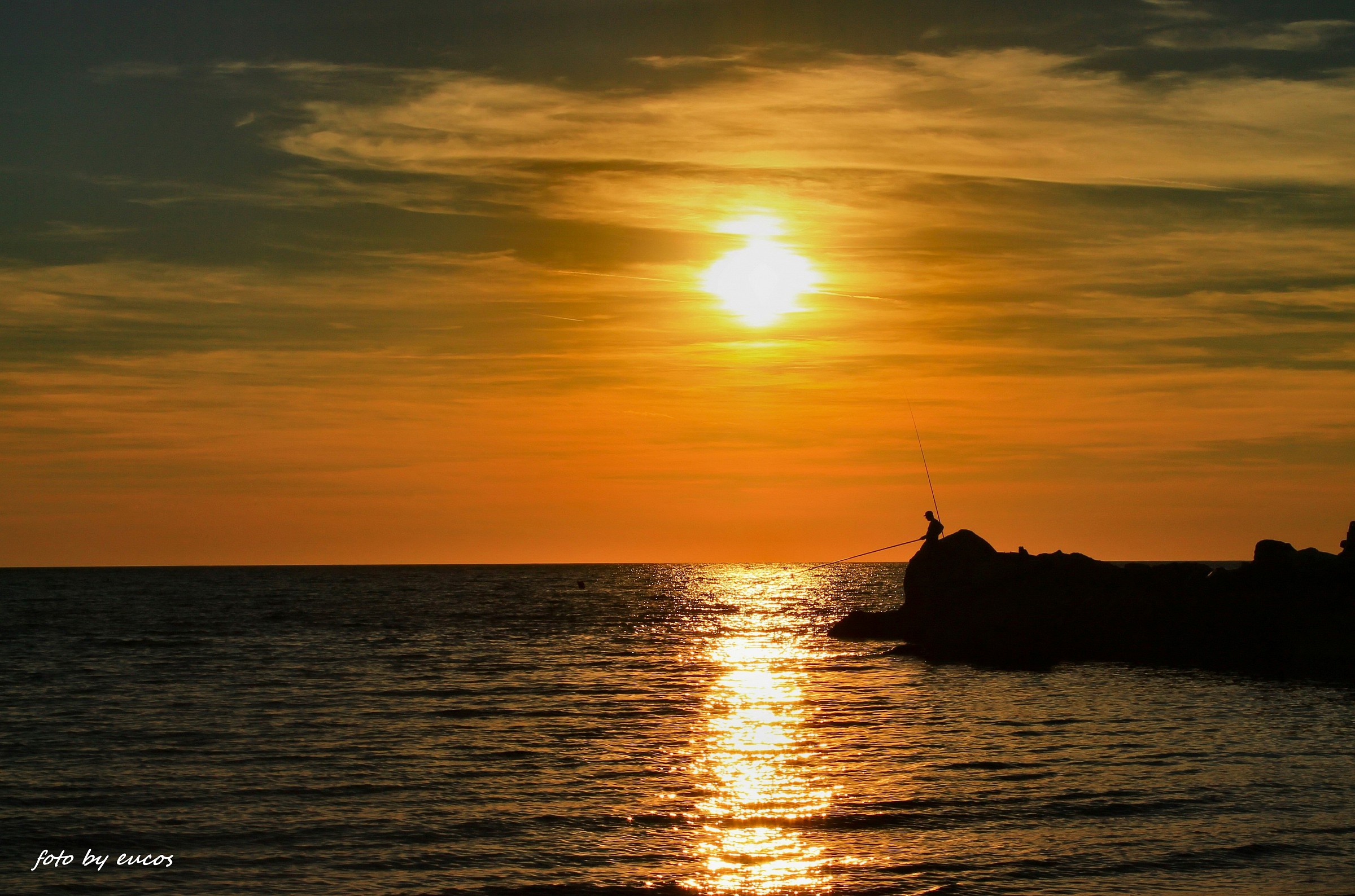 In the shadow of the last sun had dozed off a fisherman